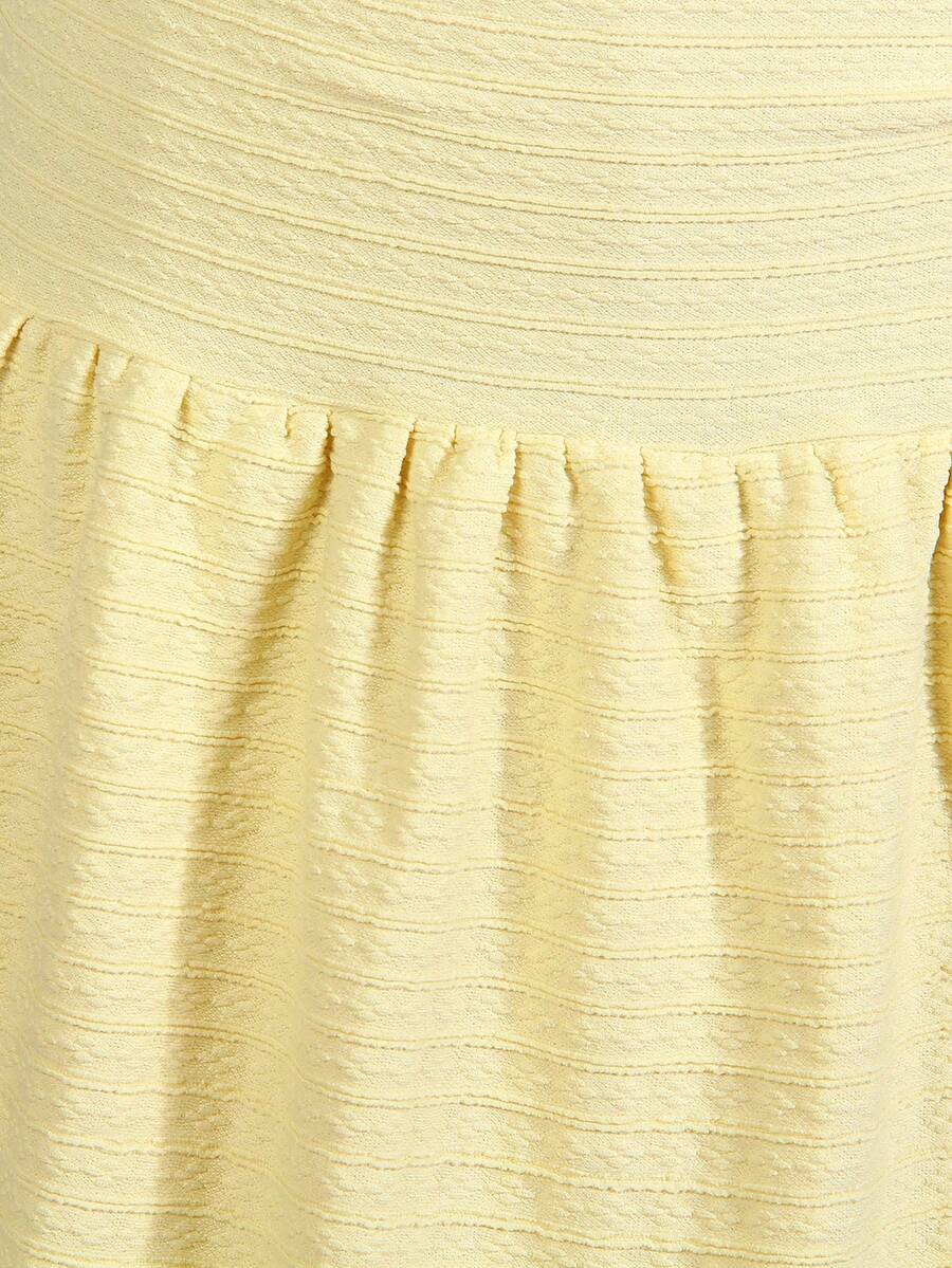 Tween girls apricot sleeveless halter mini dress with textured starfish and shell decor, shirred tiered layer, high waist, and flounce hem.