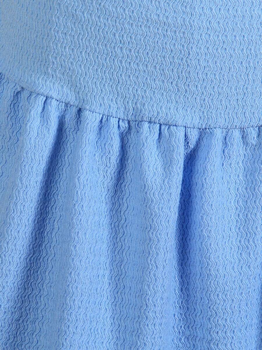 Tween girls apricot sleeveless halter mini dress with textured starfish and shell decor, shirred tiered layer, high waist, and flounce hem.