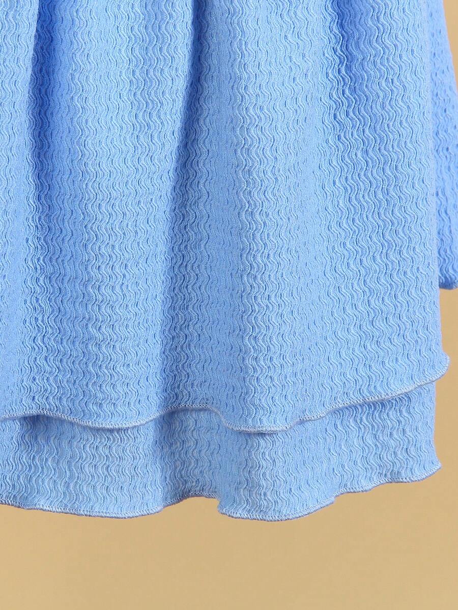 Tween girls apricot sleeveless halter mini dress with textured starfish and shell decor, shirred tiered layer, high waist, and flounce hem.