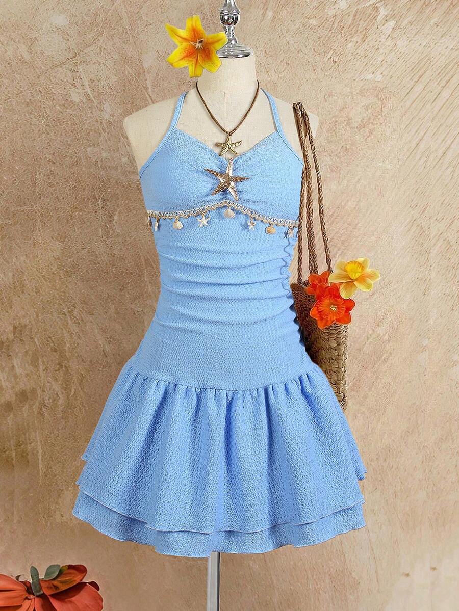 Tween girls apricot sleeveless halter mini dress with textured starfish and shell decor, shirred tiered layer, high waist, and flounce hem.