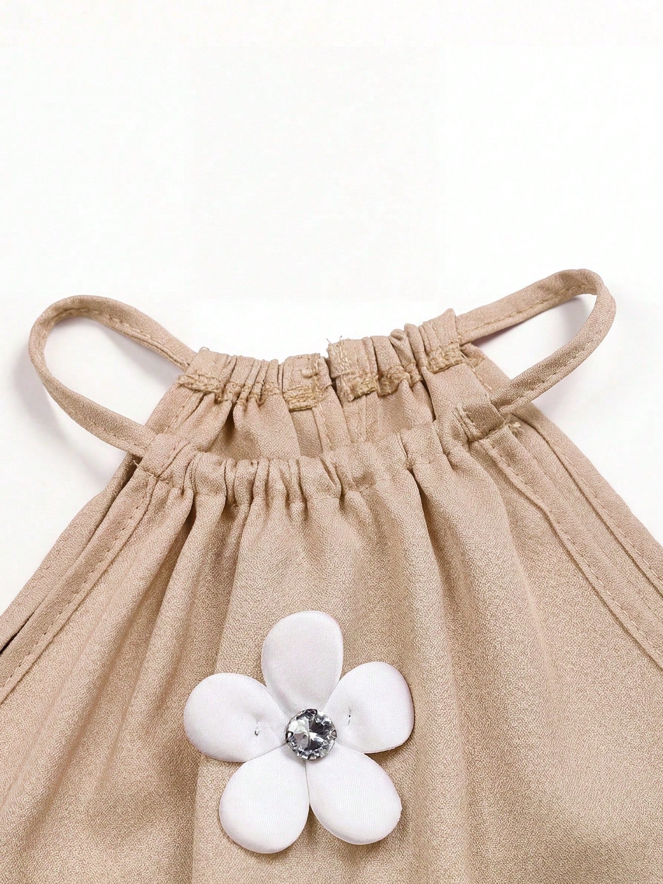 Tween girls floral print dress with halter neckline, sleeveless cold shoulder design, A-line shape, and vacation style.
