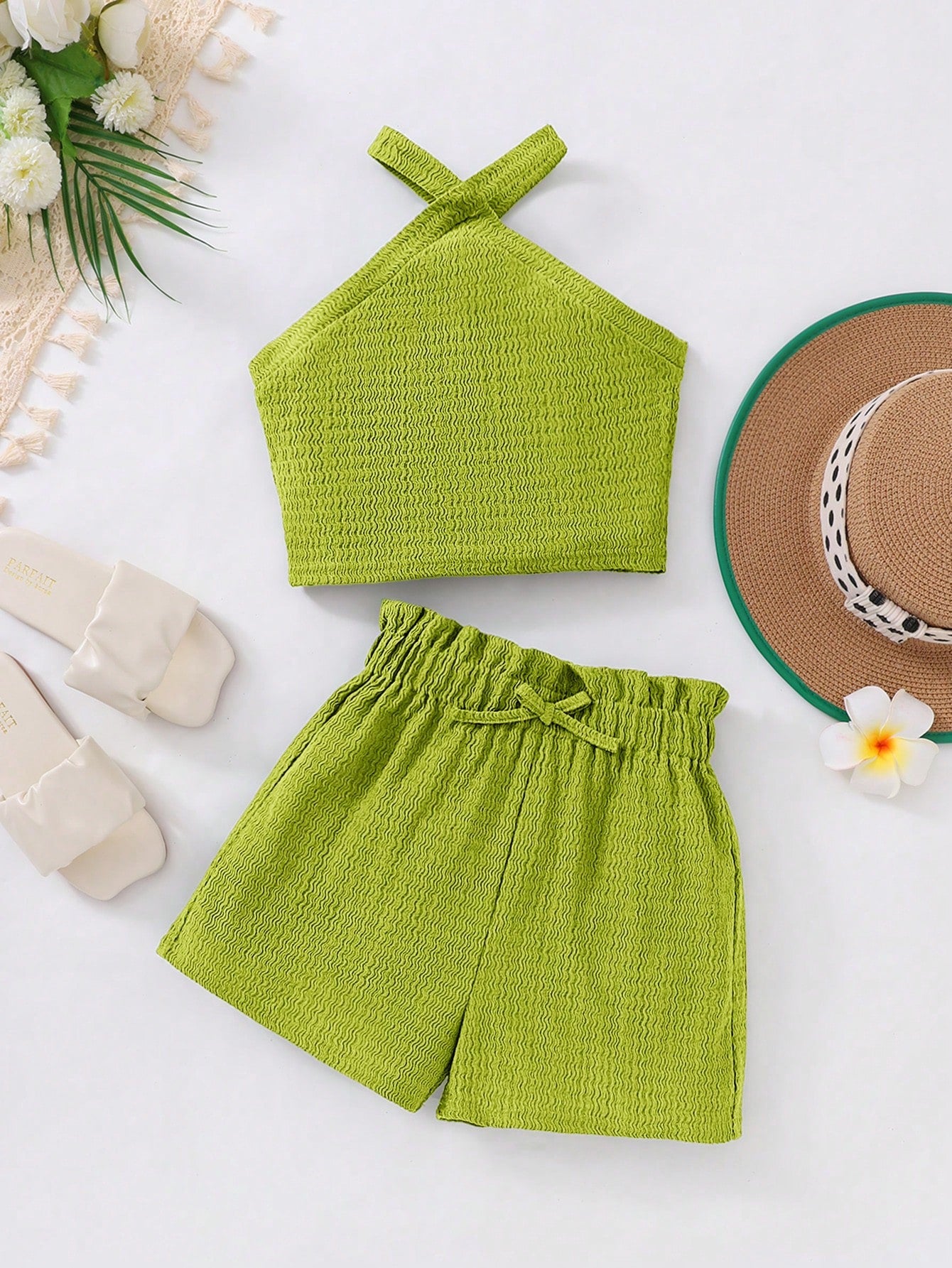 Tween girl 2-piece casual outfit set featuring a solid beige knit halter sleeveless top with belted detail and matching shorts.
