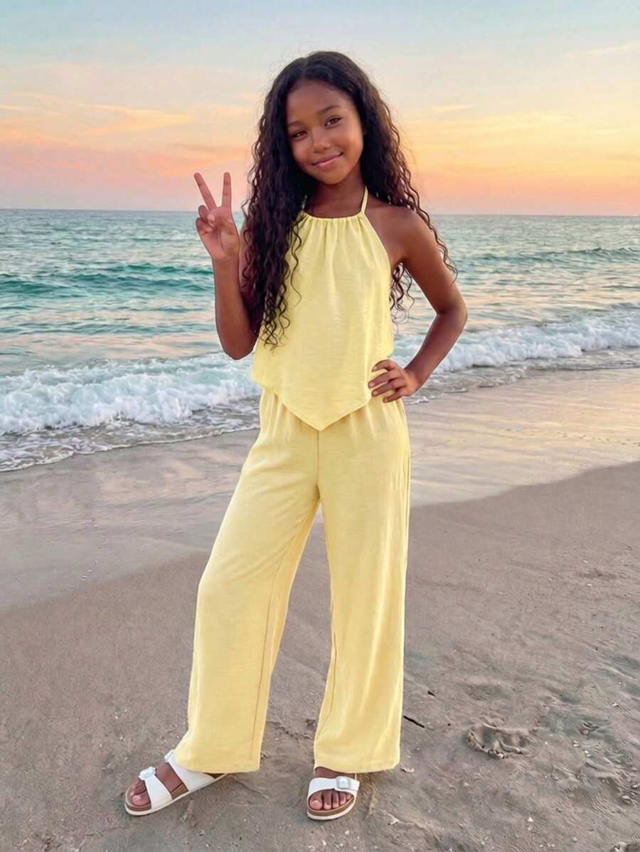 Tween girls casual apricot striped two-piece set featuring a sleeveless halter short top with curved hem and matching long pants.