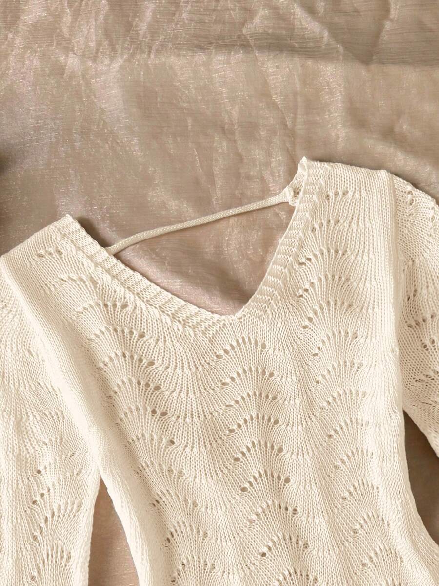 Girls semi-sheer beach cover-up dress with V-neckline, long sleeves, backless side-tie design, and asymmetrical hem for tween summer beach vacations.