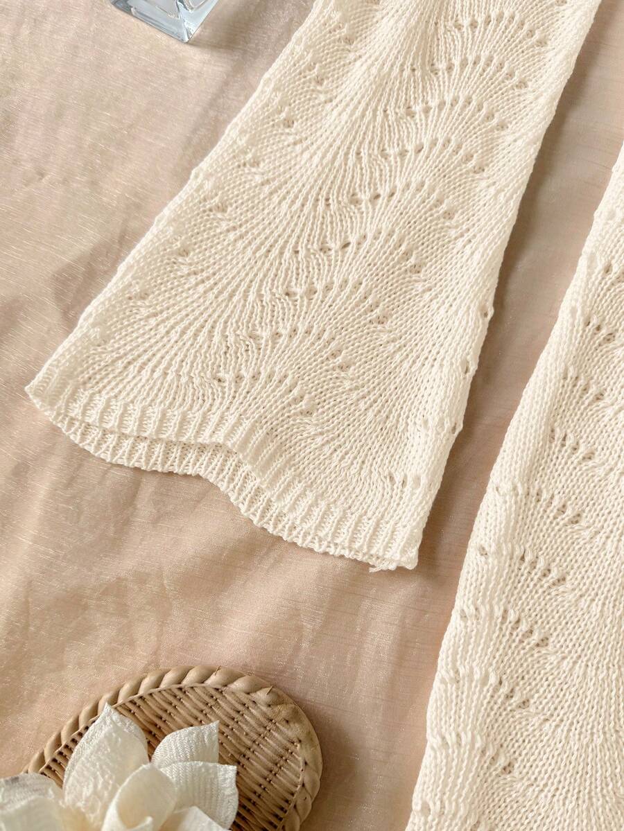 Girls semi-sheer beach cover-up dress with V-neckline, long sleeves, backless side-tie design, and asymmetrical hem for tween summer beach vacations.