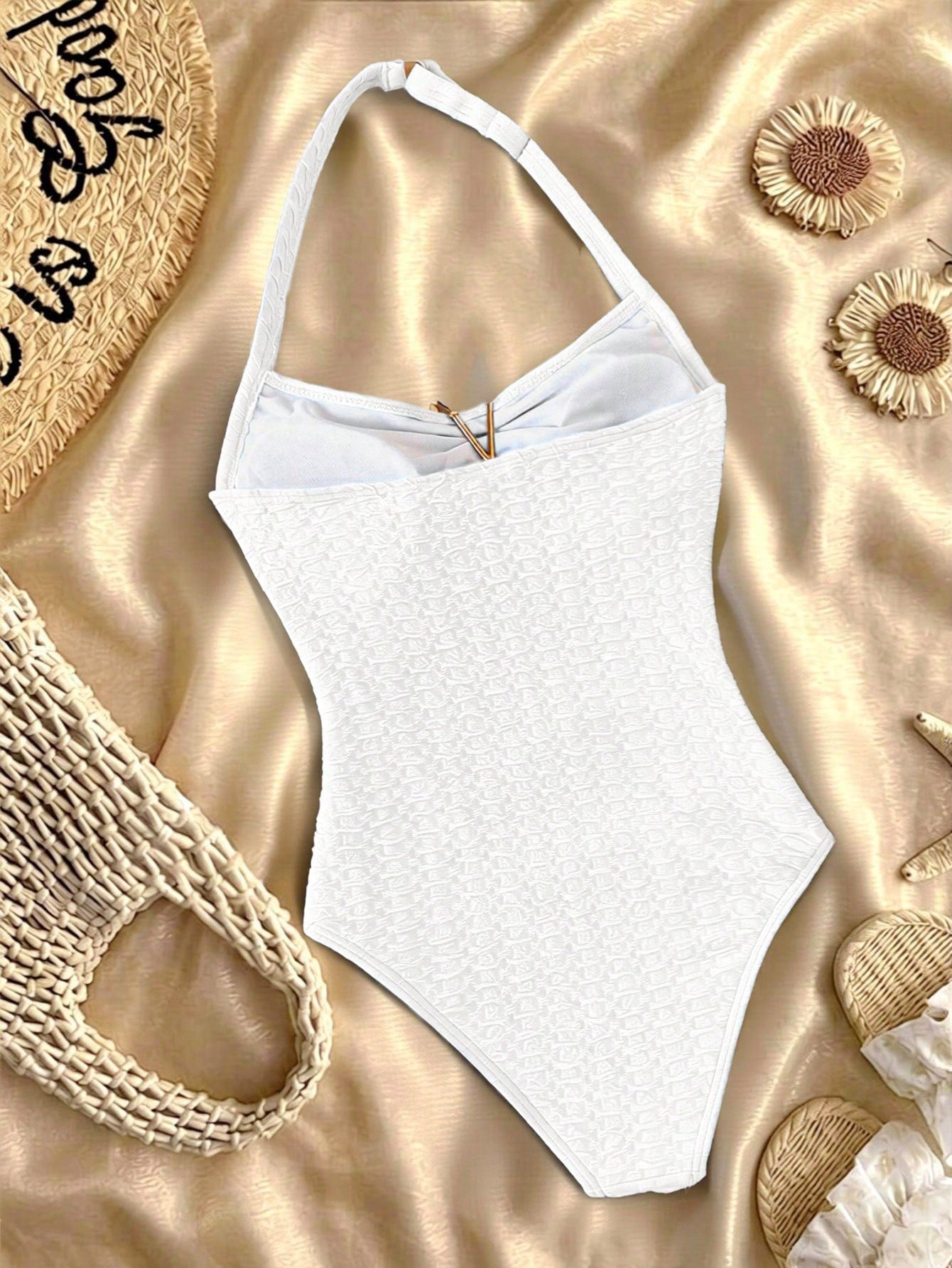 Tween girls one-piece swimsuit with polka dot-inspired all-over print, bow detail, spaghetti strap halter neckline, and lined stretch fabric for beach or vacation wear