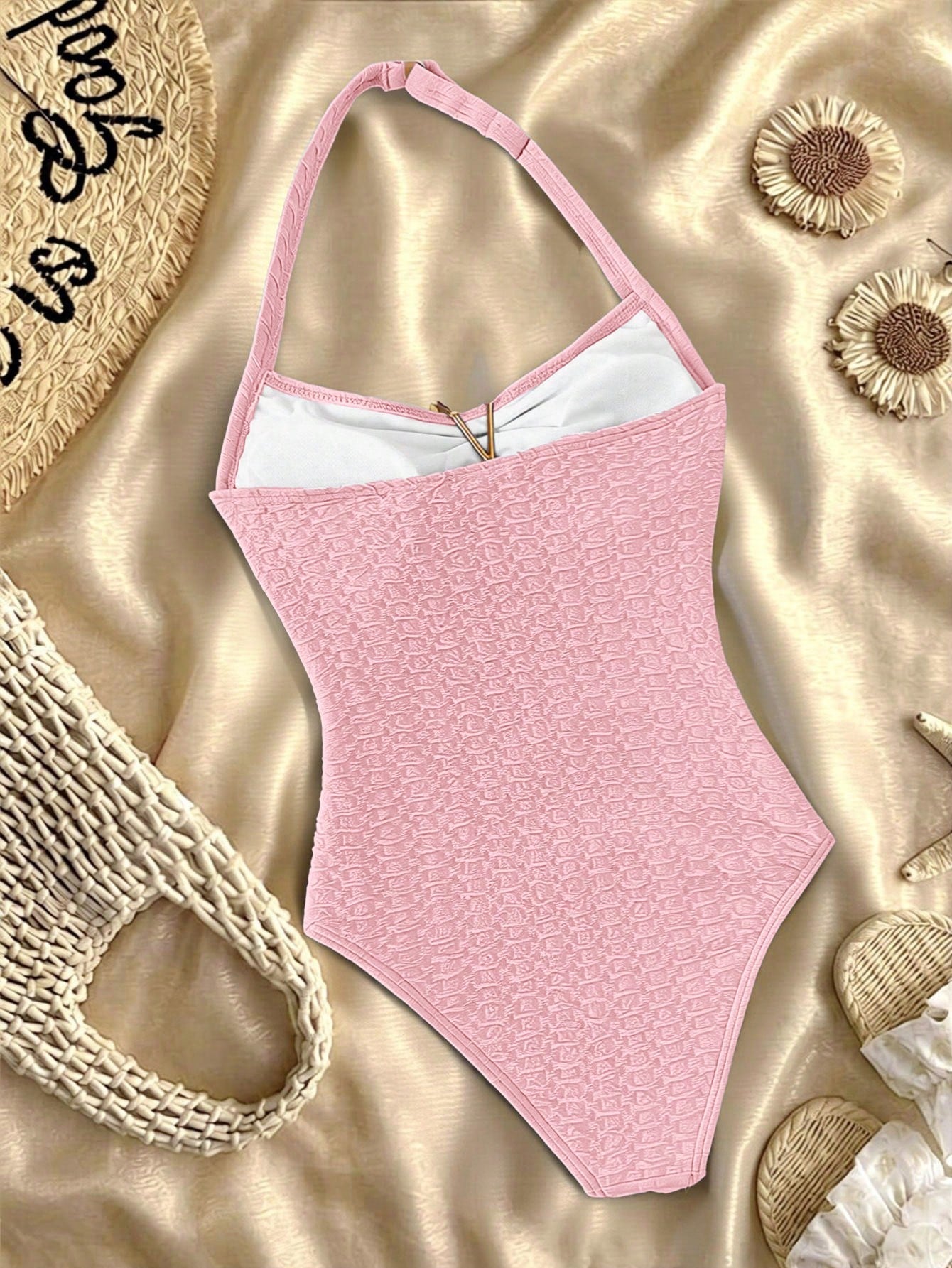 Tween girls one-piece swimsuit with polka dot-inspired all-over print, bow detail, spaghetti strap halter neckline, and lined stretch fabric for beach or vacation wear
