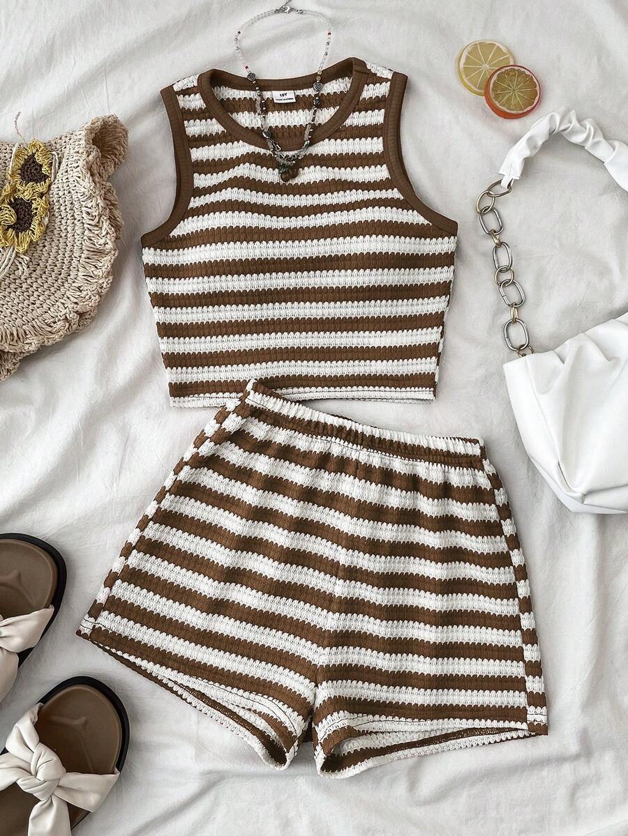 Tween girls black and white two-piece casual summer outfit featuring a rib-knit cropped top with round neck and matching shorts with contrast piping.