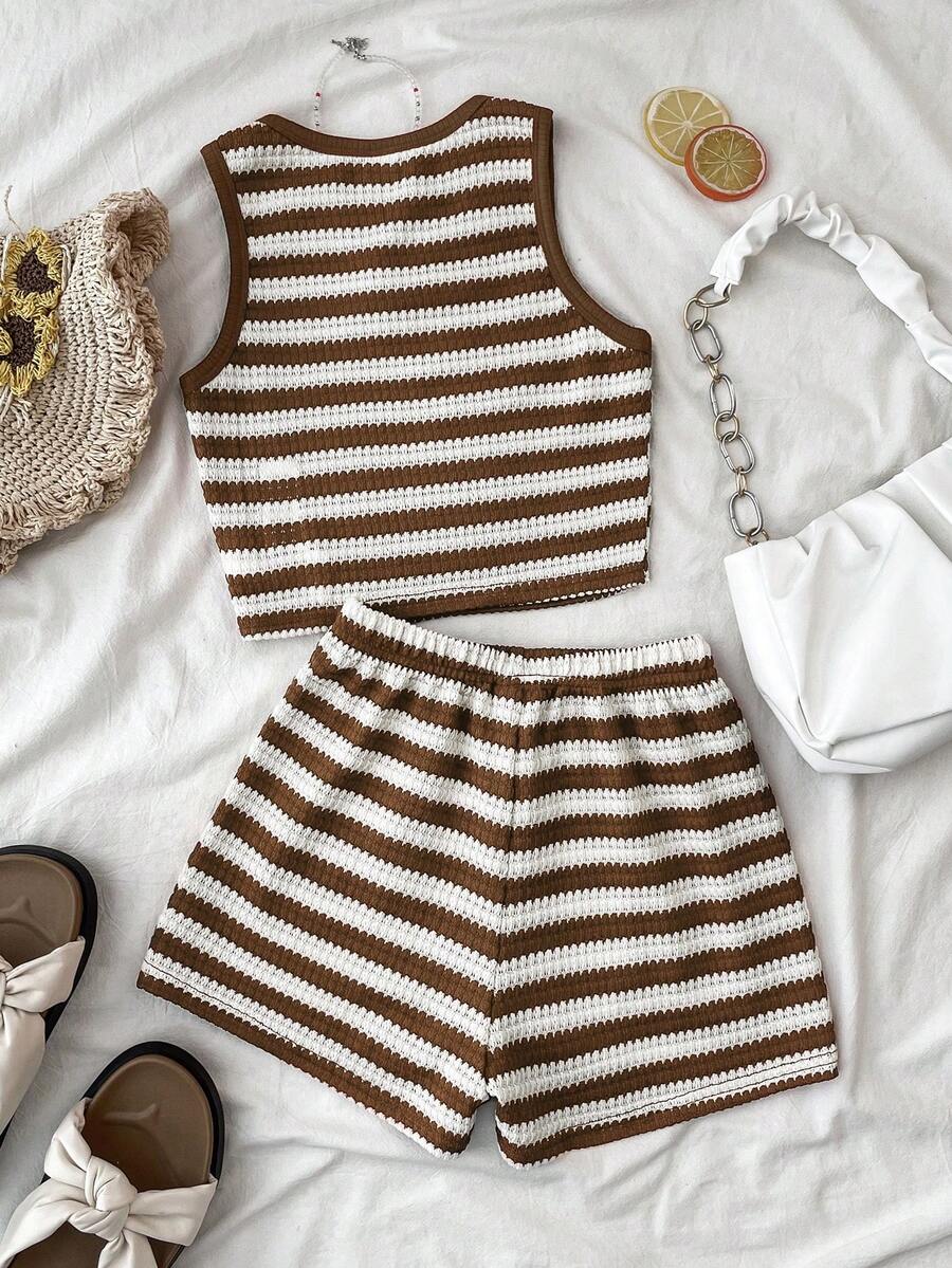 Tween girls black and white two-piece casual summer outfit featuring a rib-knit cropped top with round neck and matching shorts with contrast piping.