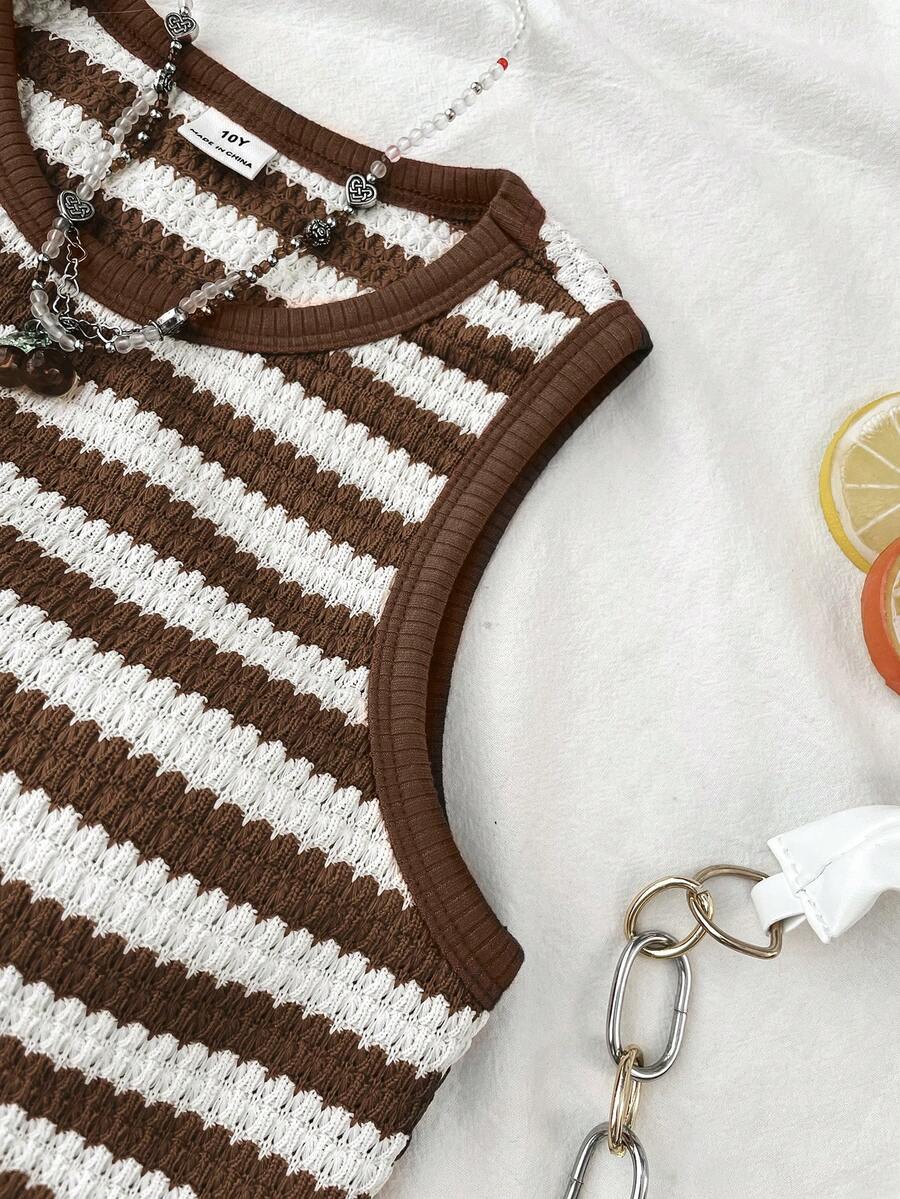 Tween girls black and white two-piece casual summer outfit featuring a rib-knit cropped top with round neck and matching shorts with contrast piping.