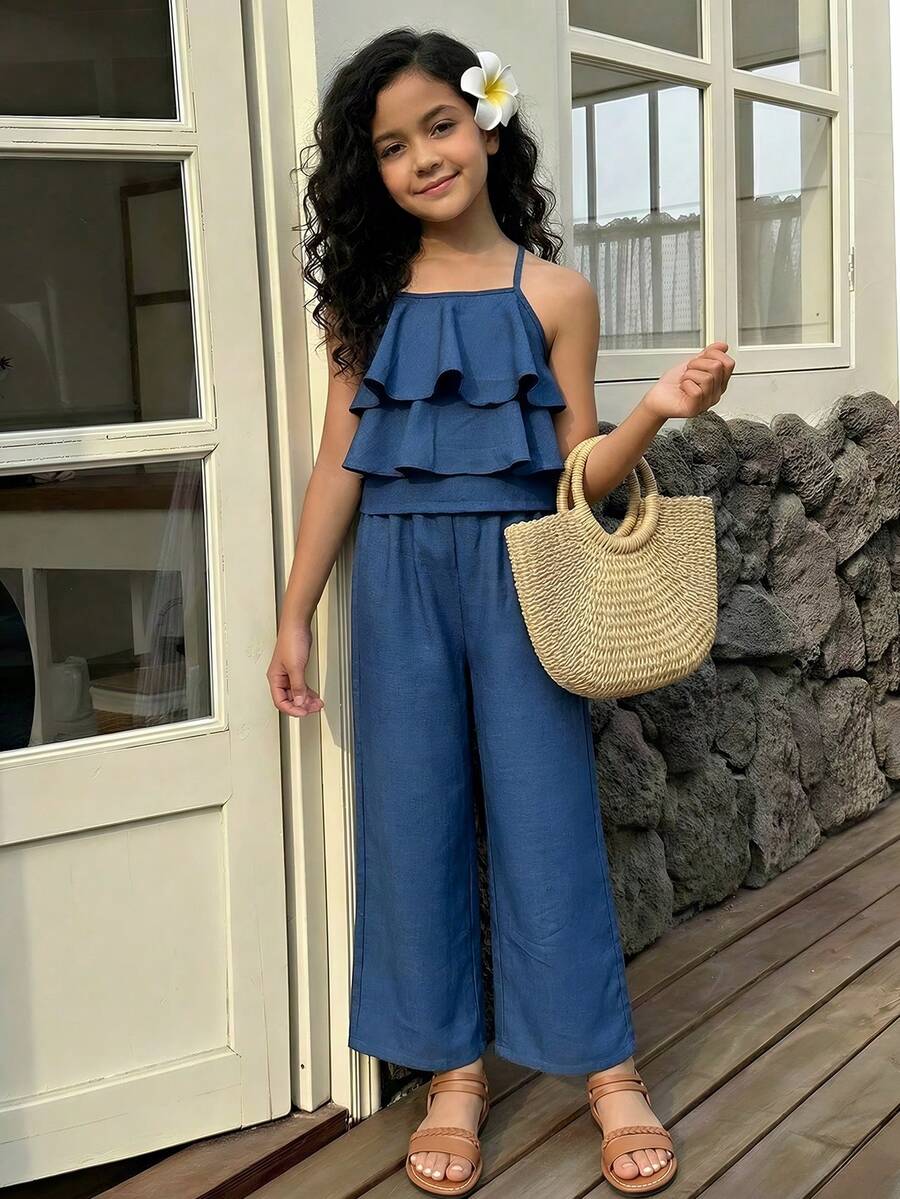 Tween girls blue 2-piece vacation outfit set featuring a tiered ruffle spaghetti strap camisole and loose high-waist pants.