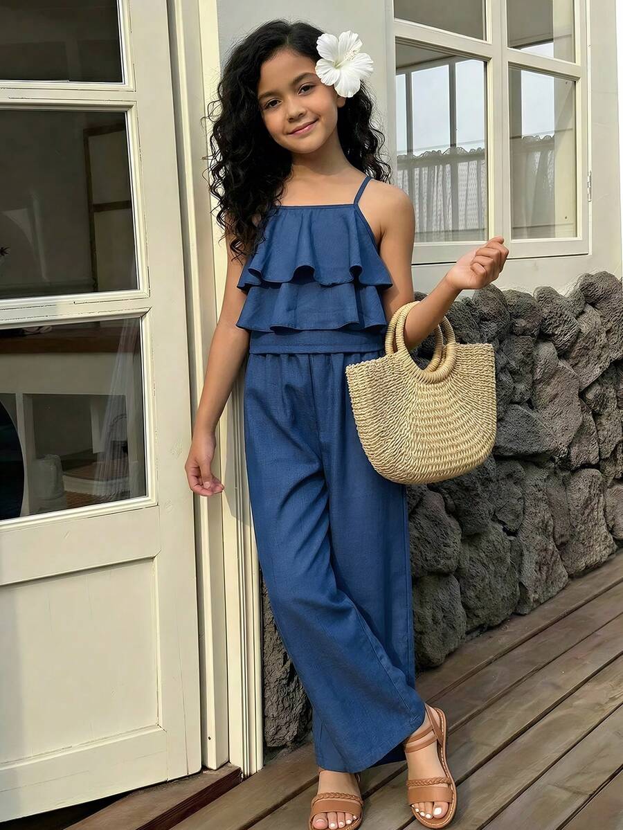 Tween girls blue 2-piece vacation outfit set featuring a tiered ruffle spaghetti strap camisole and loose high-waist pants.