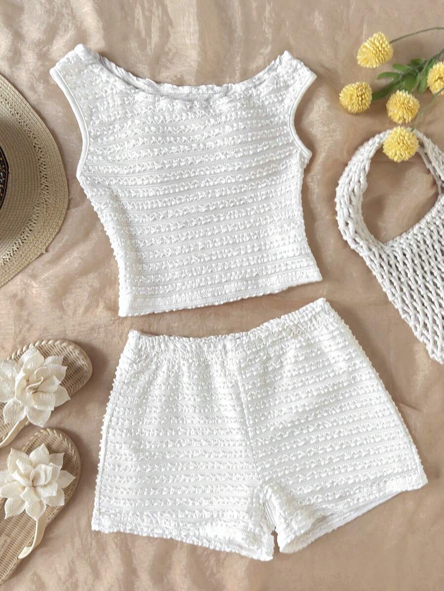 Tween girls 2-piece summer clothing set featuring a black asymmetric rib-knit striped off-shoulder t-shirt and matching slim fit shorts.