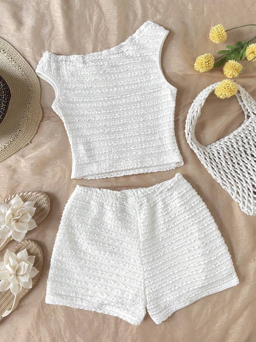 Tween girls 2-piece summer clothing set featuring a black asymmetric rib-knit striped off-shoulder t-shirt and matching slim fit shorts.