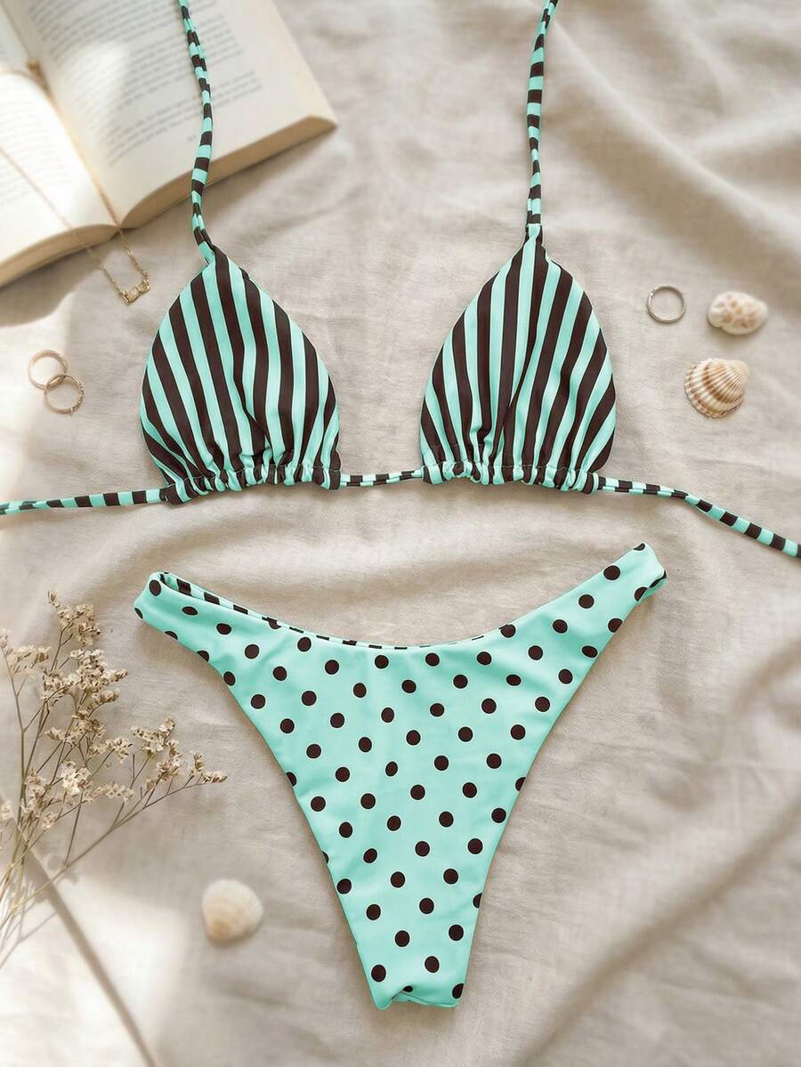Women's two-piece halter bikini set featuring high cut thong bottoms and removable padding