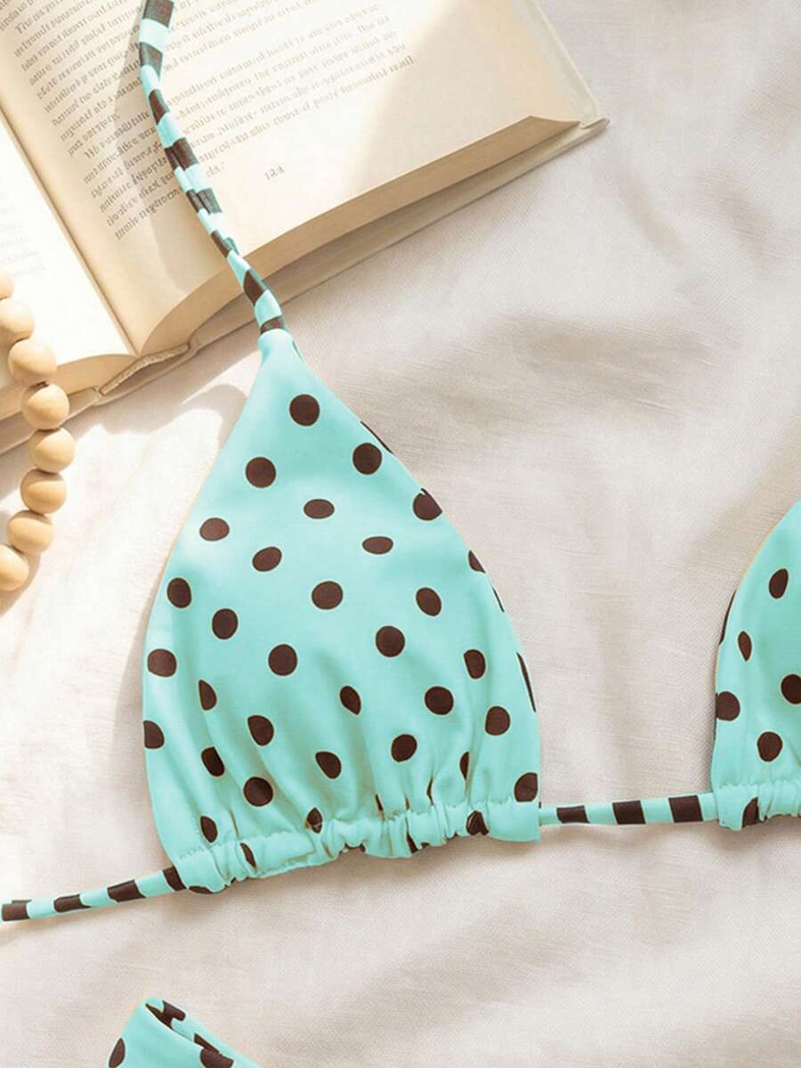 Women's two-piece halter bikini set featuring high cut thong bottoms and removable padding