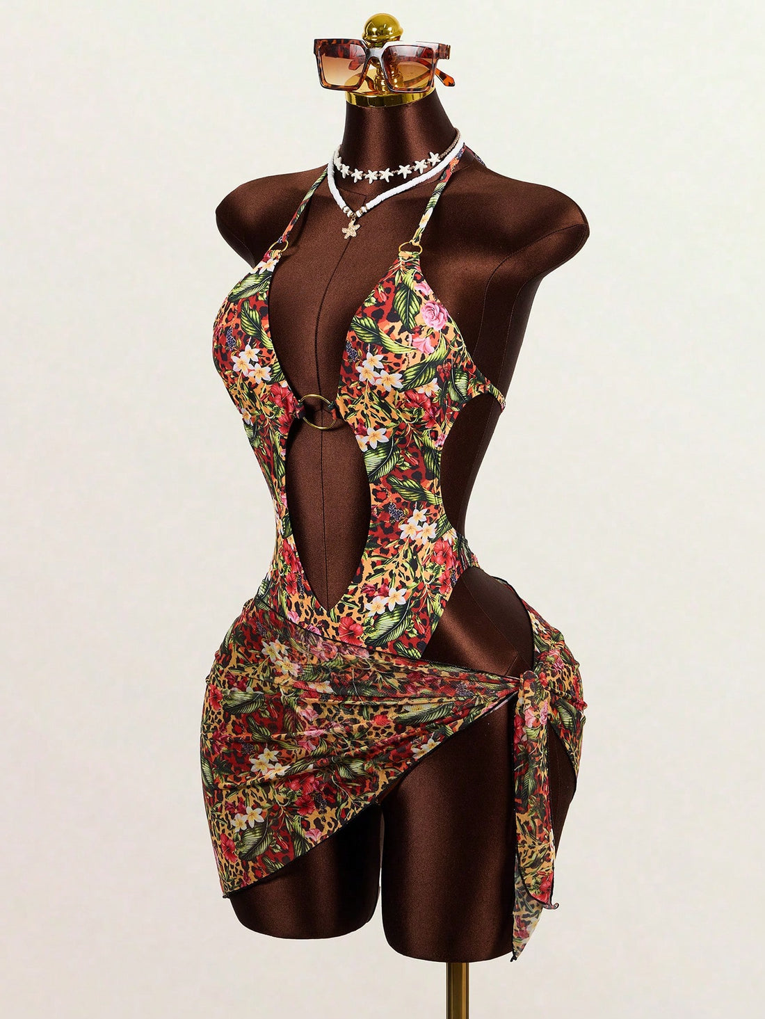 Multicolor leopard print 2-piece swimsuit set featuring a plunge neck top and a matching short cover-up skirt for women.