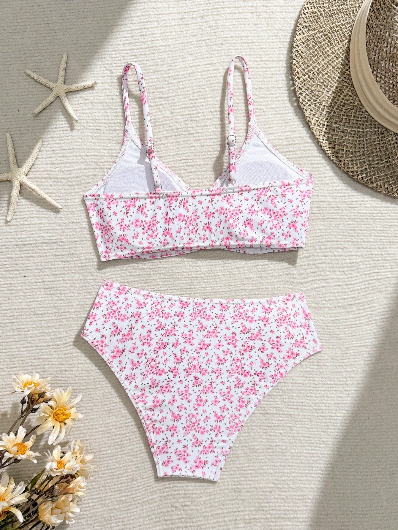 Tween girls 2-piece ditsy floral bikini set featuring a spaghetti strap top with center string detail and matching bottoms with side strings, designed for swimming, vacation, and summer wear.