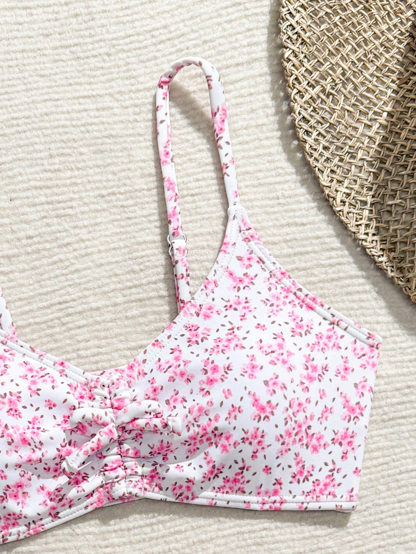 Tween girls 2-piece ditsy floral bikini set featuring a spaghetti strap top with center string detail and matching bottoms with side strings, designed for swimming, vacation, and summer wear.