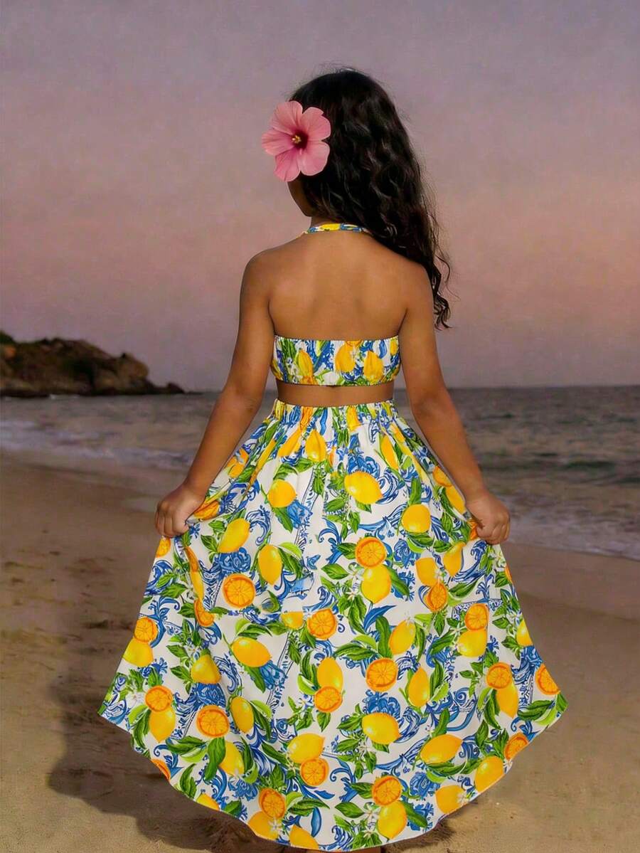 Tween girls floral halter dress with backless sleeveless design, belted high waist, shirred details, appliques, and flared A-line midi silhouette for summer vacation or graduation outfit.