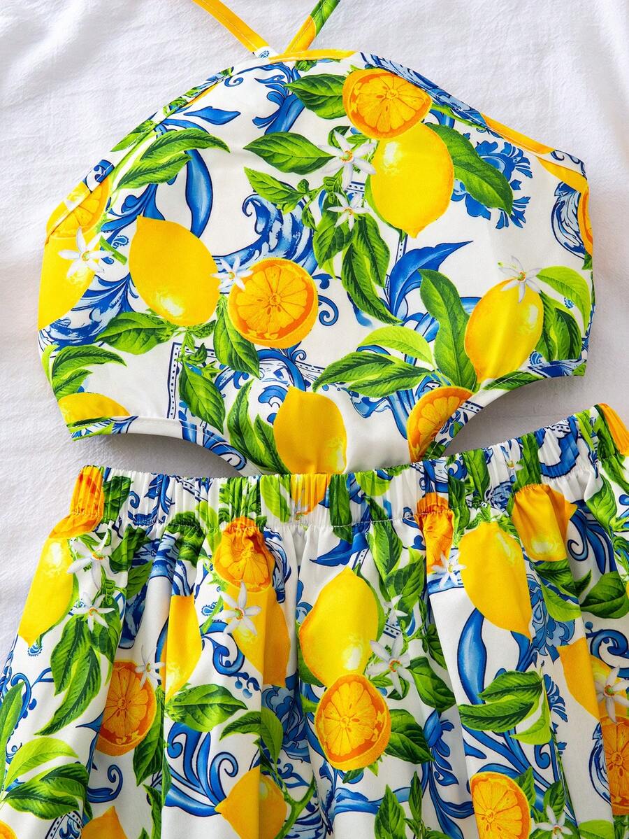 Tween girls floral halter dress with backless sleeveless design, belted high waist, shirred details, appliques, and flared A-line midi silhouette for summer vacation or graduation outfit.
