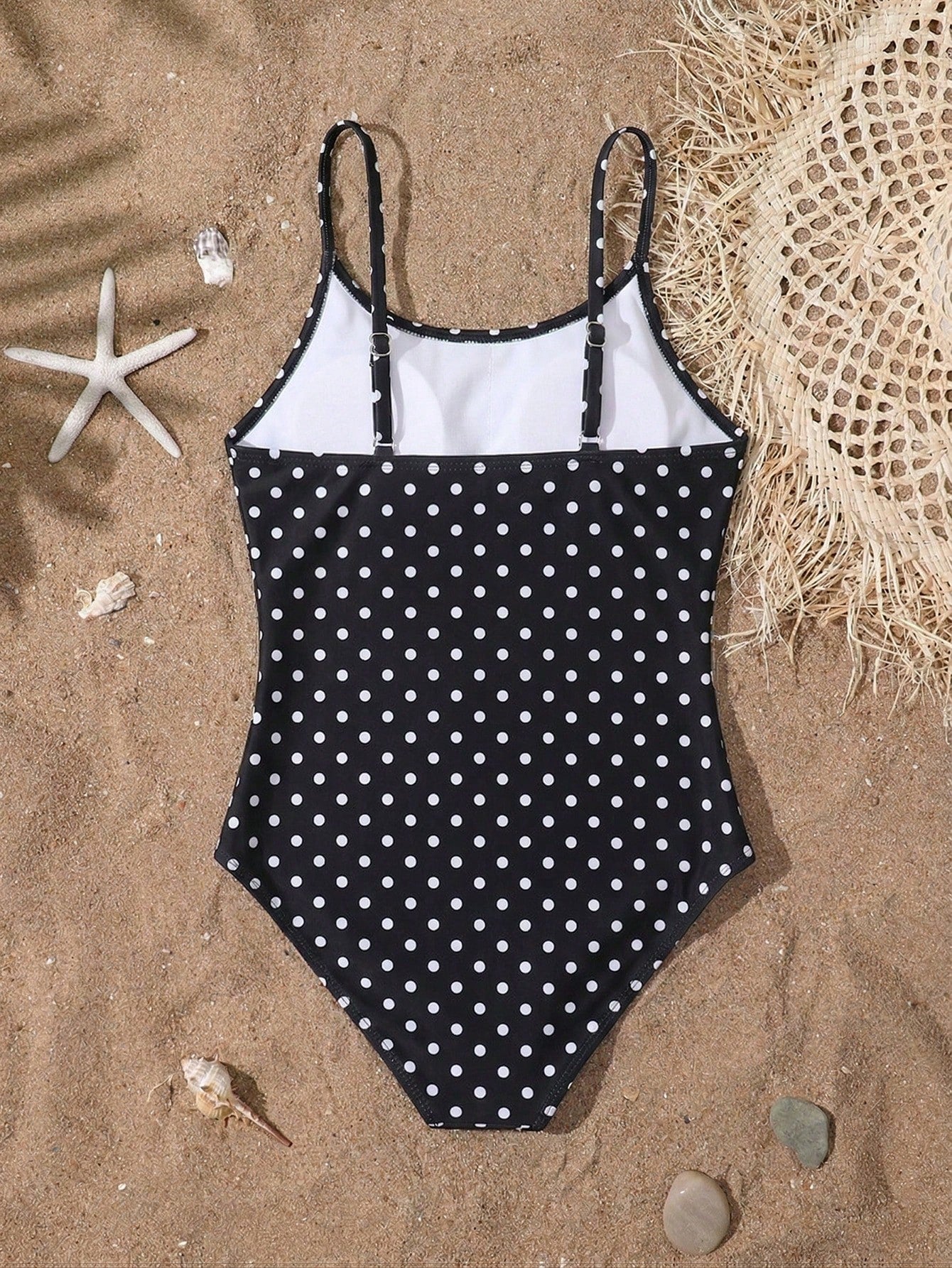 Tween girls one-piece swimsuit with multicolor ocean shell and seahorse all-over print, spaghetti straps, cut-out detail, and lined body for beach or swimming.