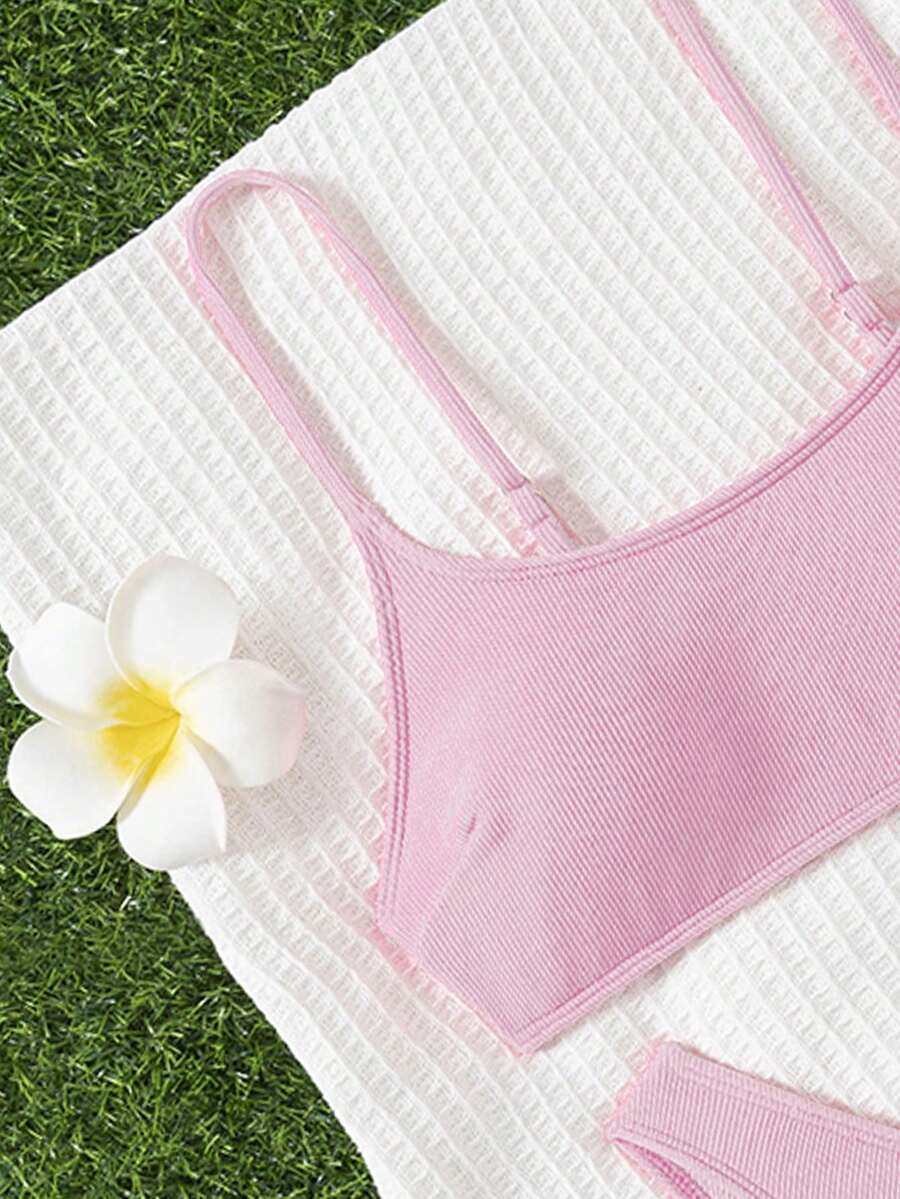Apricot ribbed high waist two piece bikini swimsuit set for women featuring backless spaghetti strap top and high waisted bottoms.