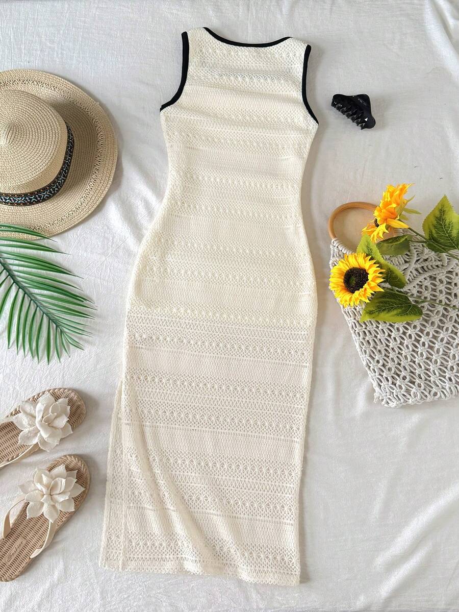 Tween girls sleeveless ditsy floral tank dress featuring a round neckline, slim fit silhouette, and side split hem.