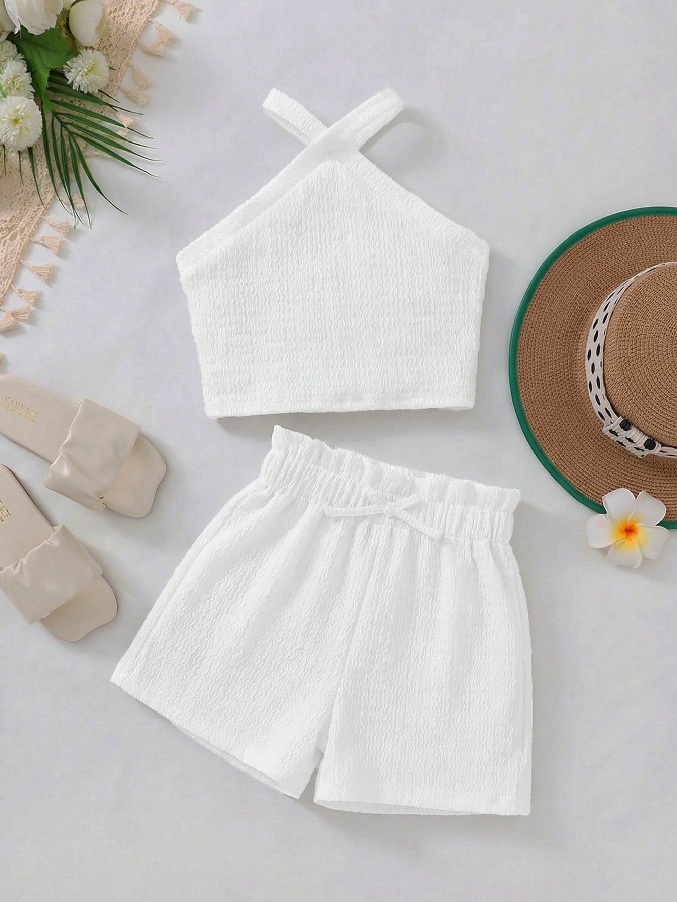 Tween girl 2-piece casual outfit set featuring a solid beige knit halter sleeveless top with belted detail and matching shorts.
