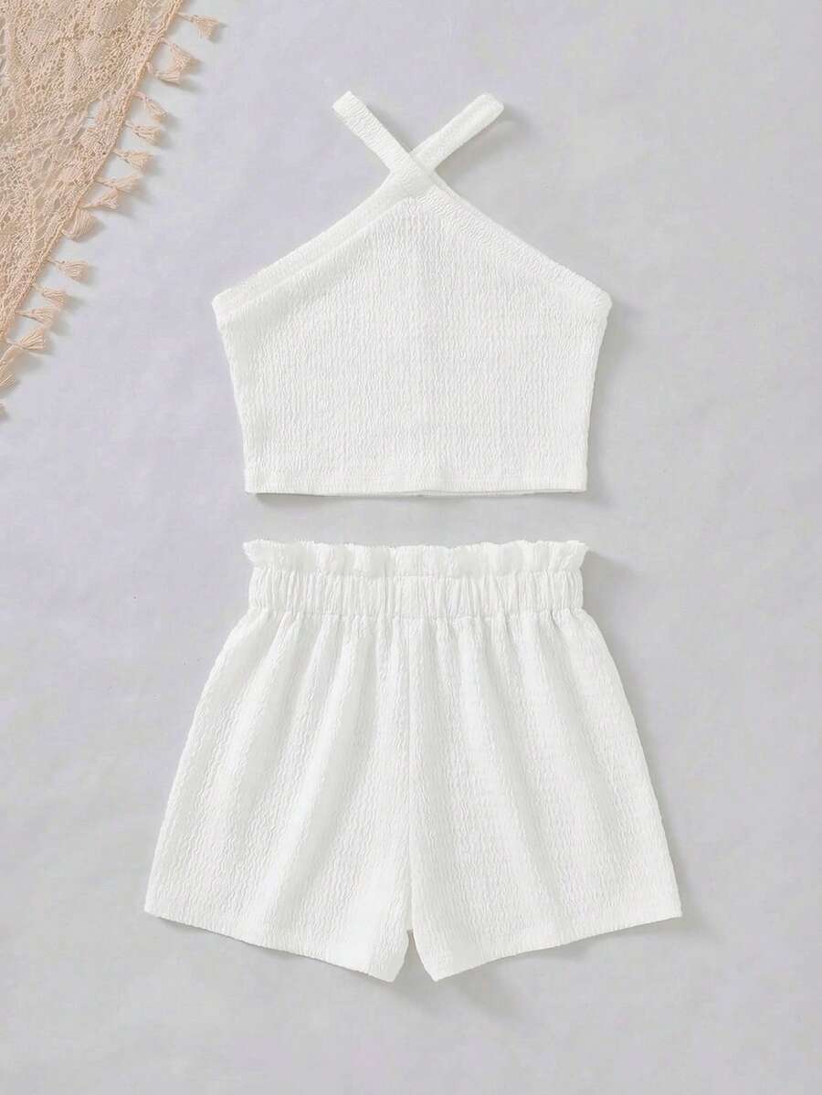 Tween girl 2-piece casual outfit set featuring a solid beige knit halter sleeveless top with belted detail and matching shorts.