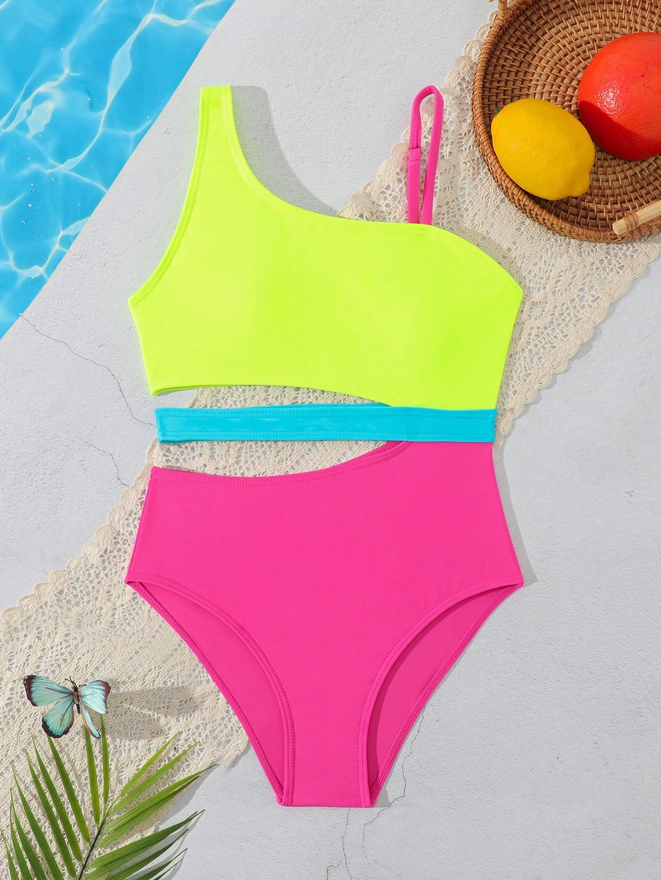 Purple tween girls one-piece swimsuit with asymmetrical neckline, cut-out waist, striped pattern, fitted silhouette, and lined body.