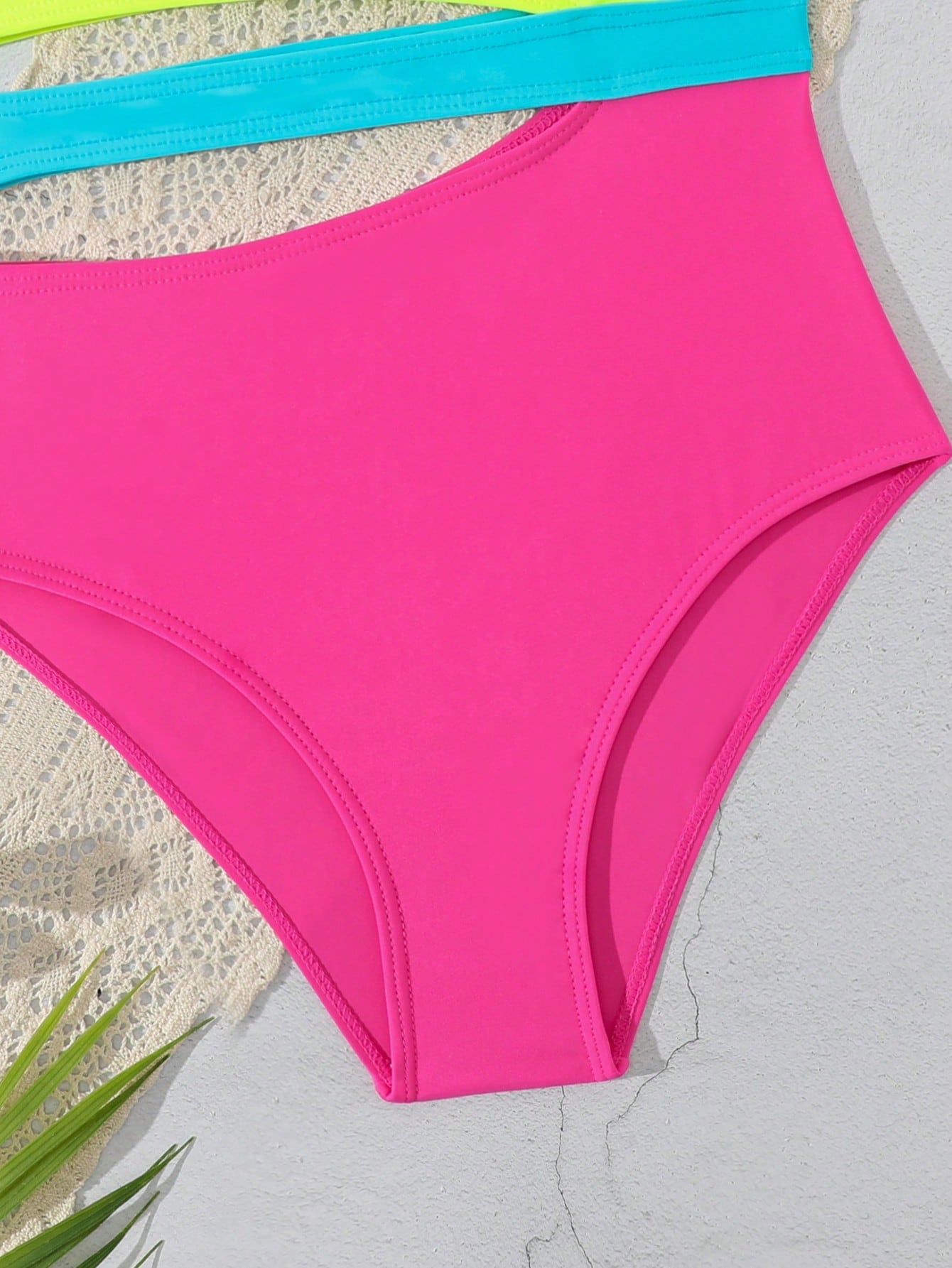 Purple tween girls one-piece swimsuit with asymmetrical neckline, cut-out waist, striped pattern, fitted silhouette, and lined body.