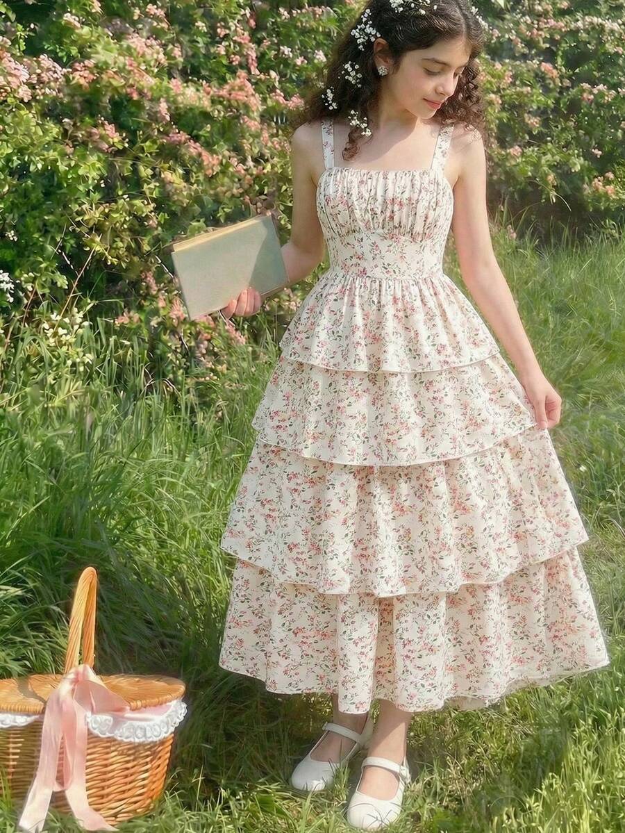 Tween girls blue ditsy floral sleeveless long dress with spaghetti straps, ruched bust, high waist, and tiered layered hem.
