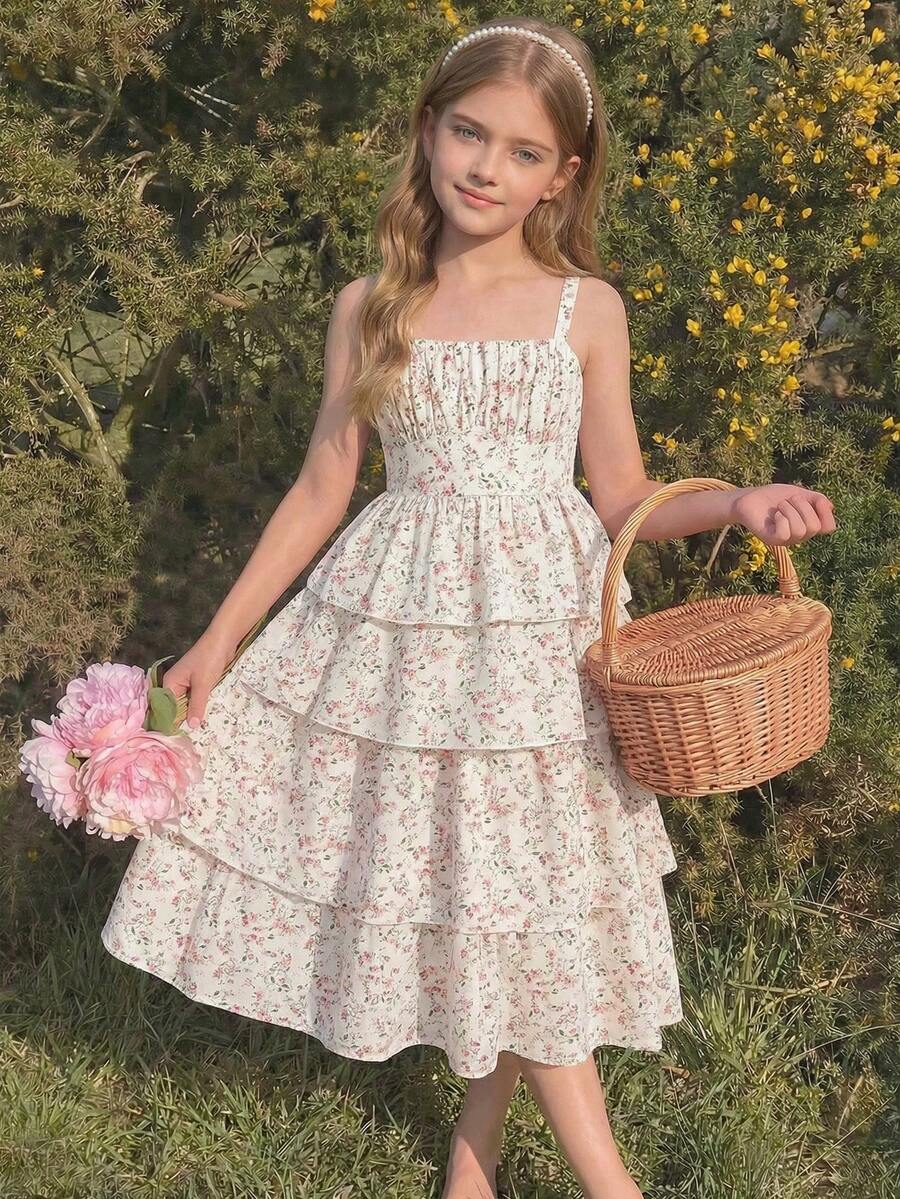 Tween girls blue ditsy floral sleeveless long dress with spaghetti straps, ruched bust, high waist, and tiered layered hem.