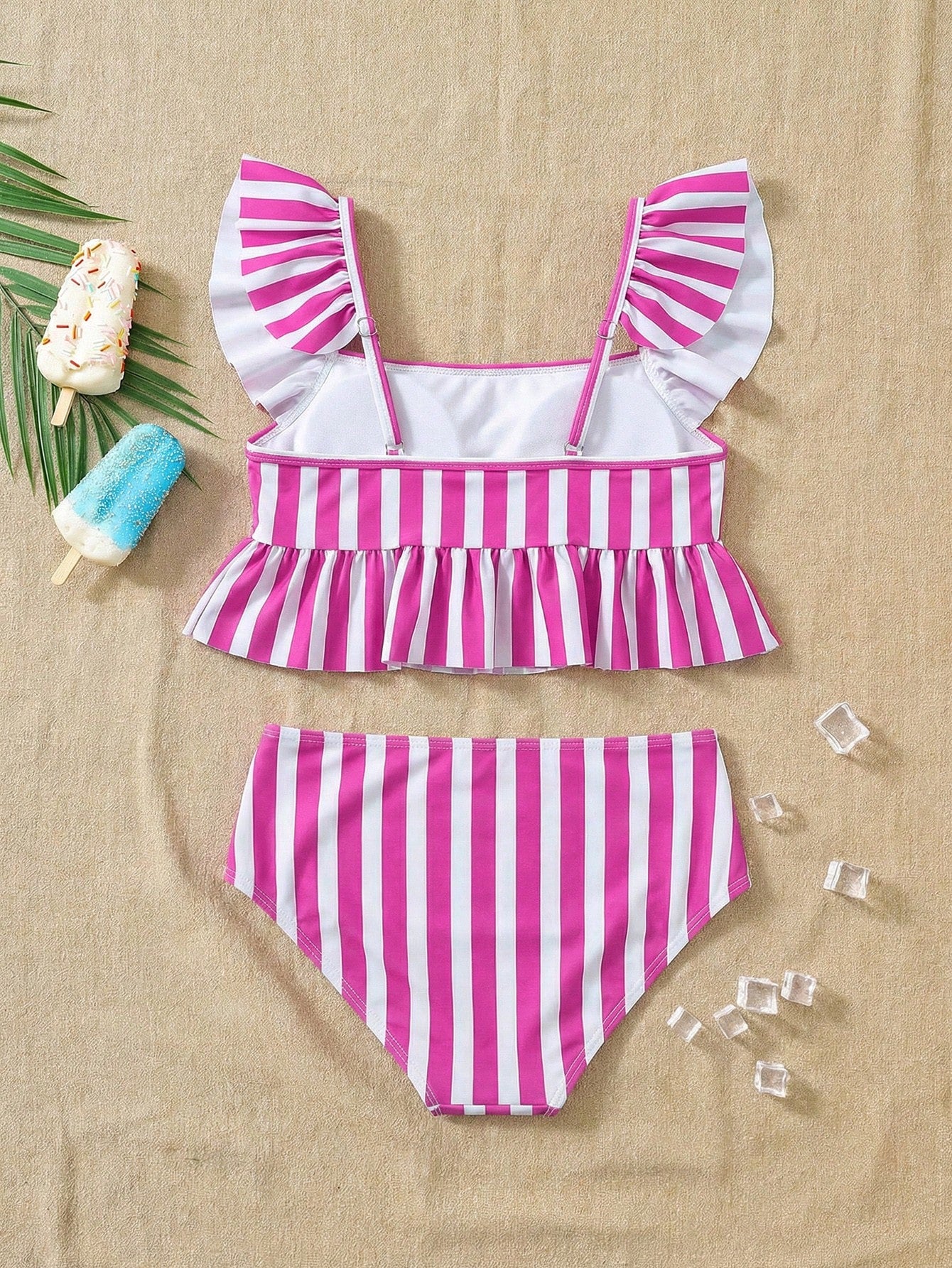 Girls striped tankini swimwear set with ruffle detail, square neckline, wireless top, and high-waist lined bottoms for beach and vacation wear.