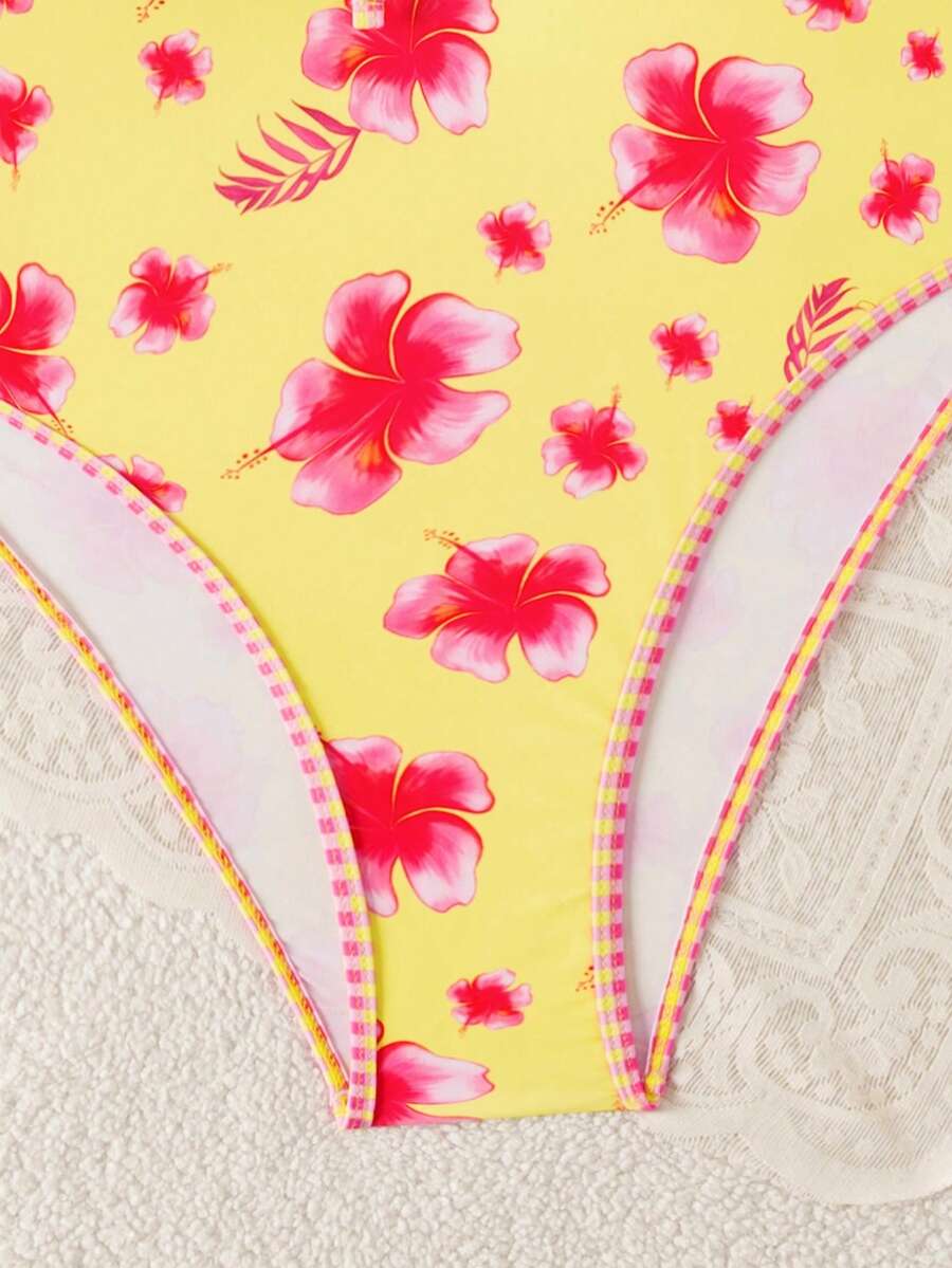 Multicolor floral print women's bikini swimsuit set featuring spaghetti straps, wireless lined bra with removable padding, backless lace-up design, and high cut bottom.
