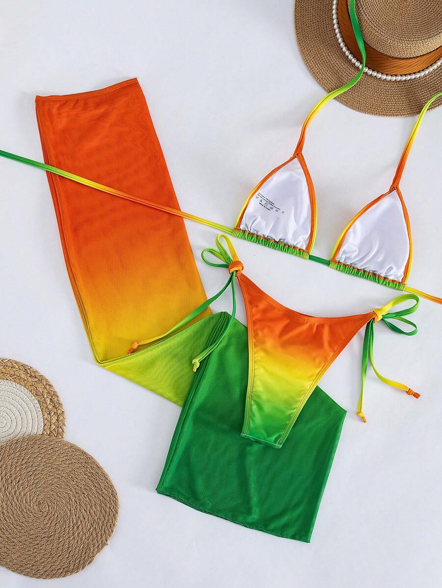 Women's 3-piece gradient bikini set featuring a green halter tie top with removable padding, low waist bottoms, and a matching sheer mesh skirt.