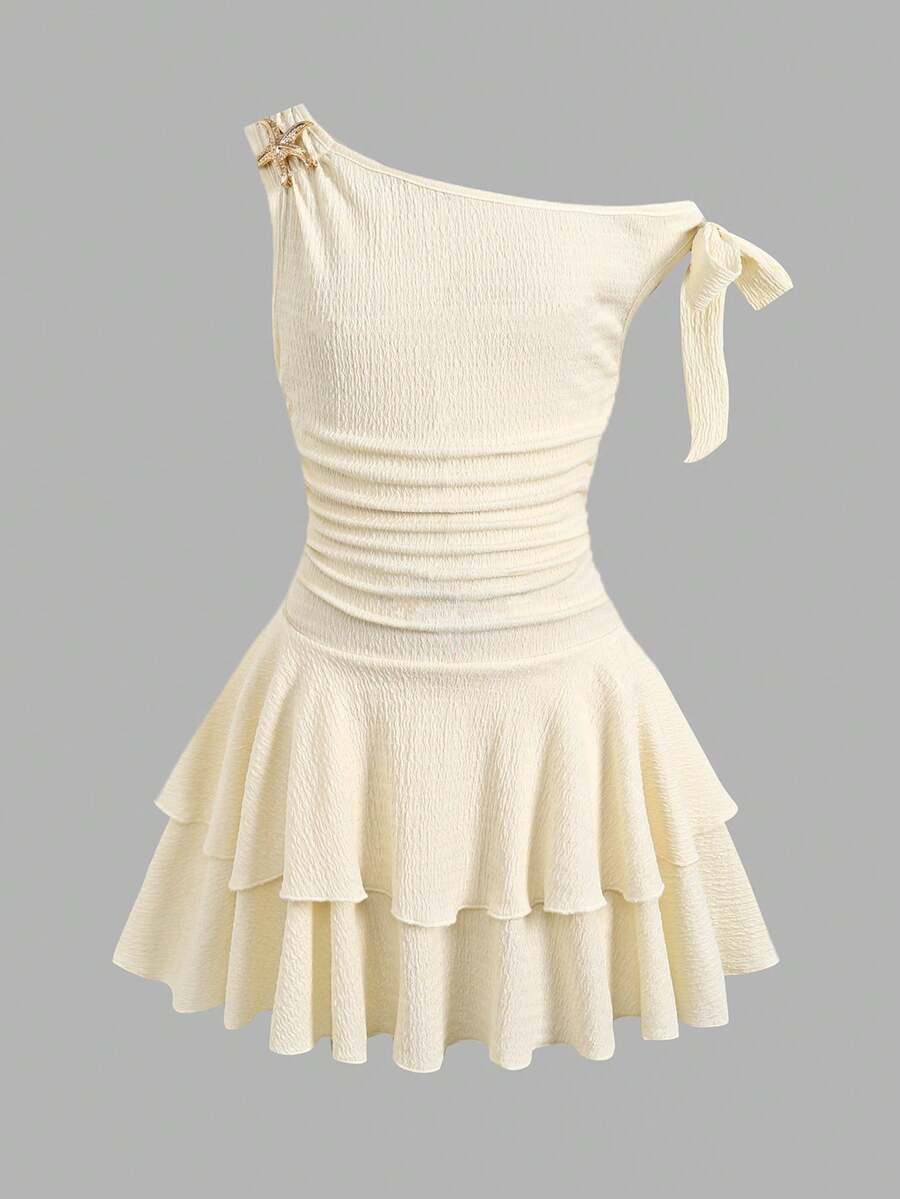 Apricot tiered asymmetrical ruffle dress for tween girls featuring short sleeves, layered hem, and slim fit A-line silhouette.