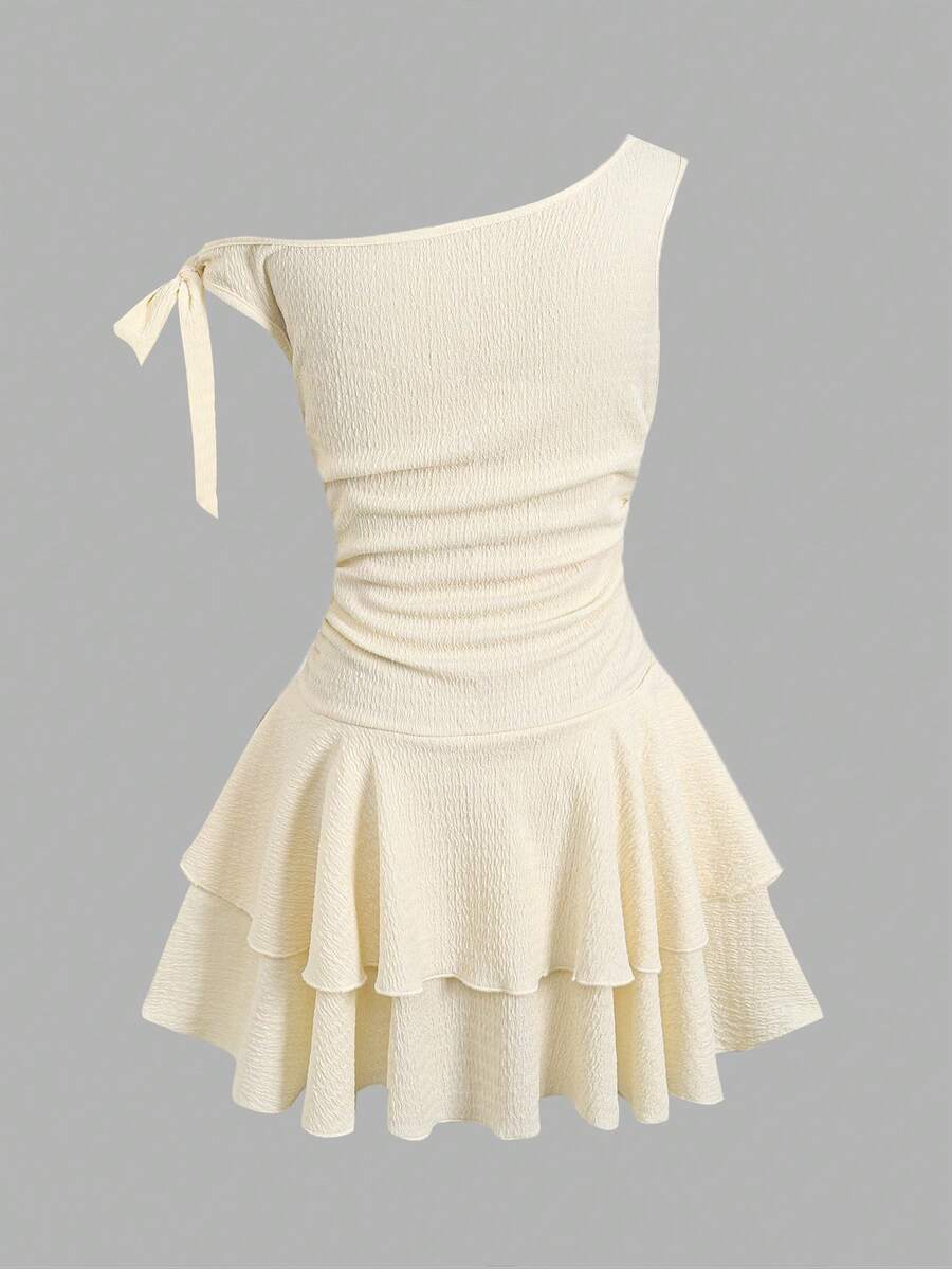 Apricot tiered asymmetrical ruffle dress for tween girls featuring short sleeves, layered hem, and slim fit A-line silhouette.