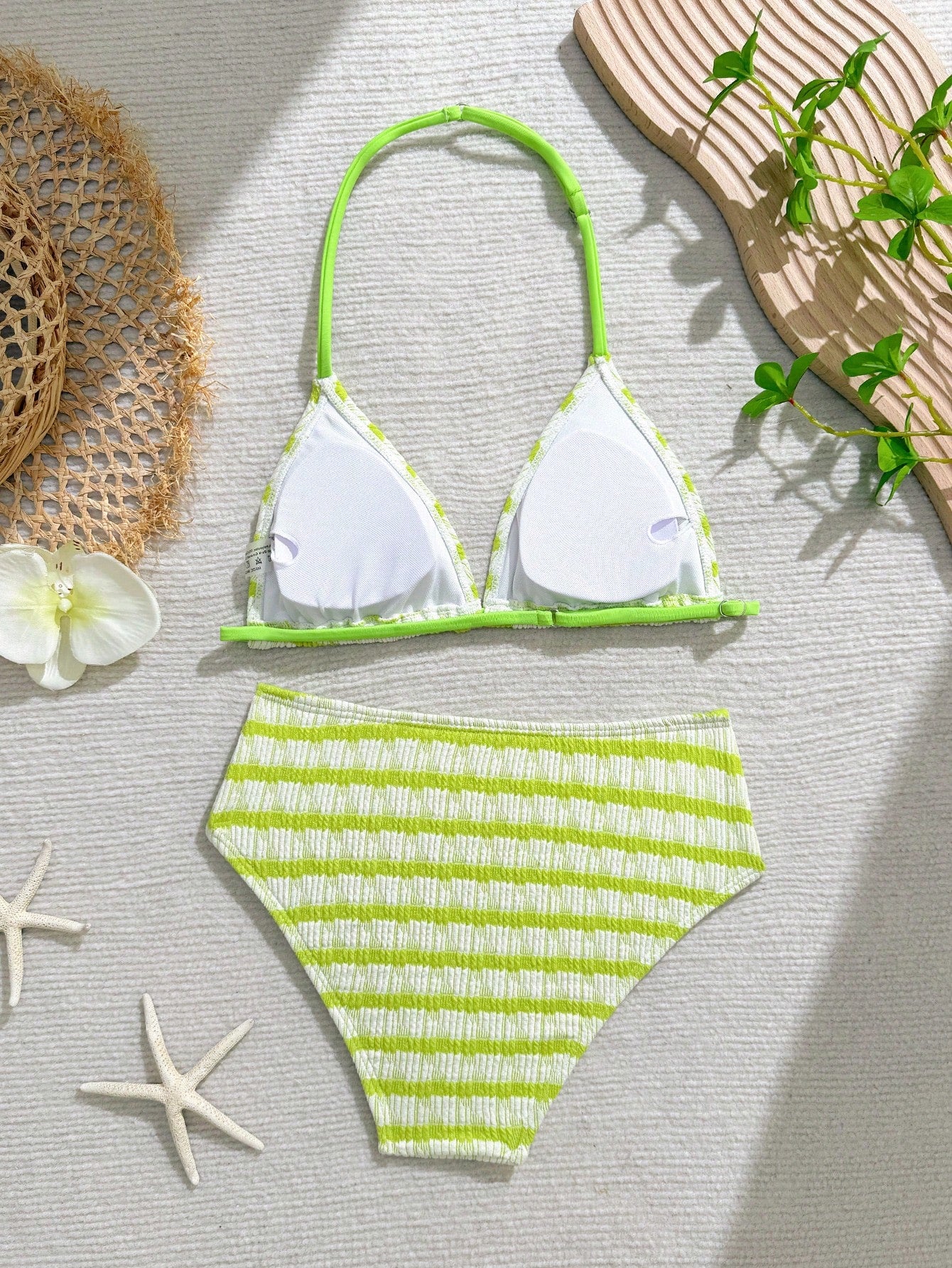 Tween girls blue and white striped two-piece bikini set with halter triangle top and mid-waist short bikini bottoms for beach and vacation swimwear.
