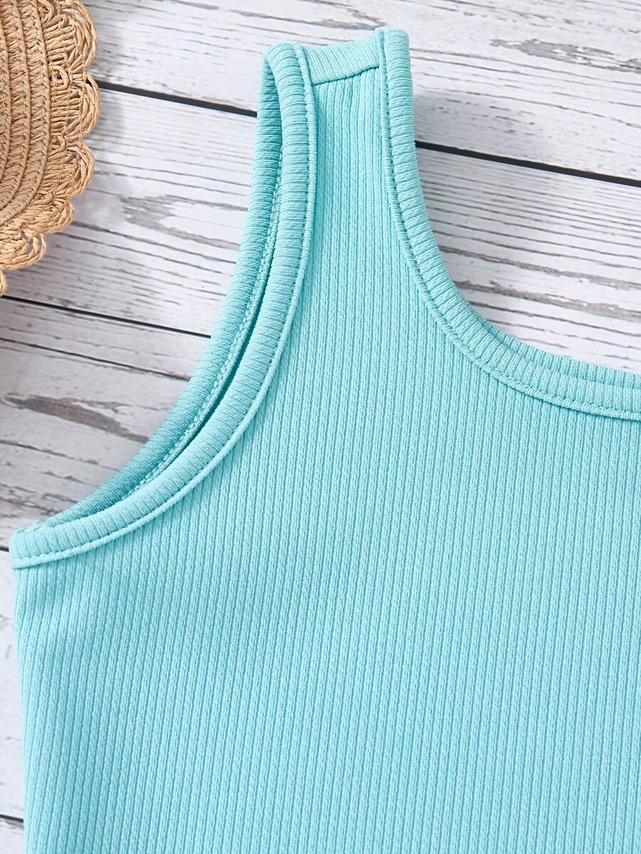 Tween girls 2-piece summer set featuring a turquoise blue ribbed tank top and tropical leaf pattern belted shorts.
