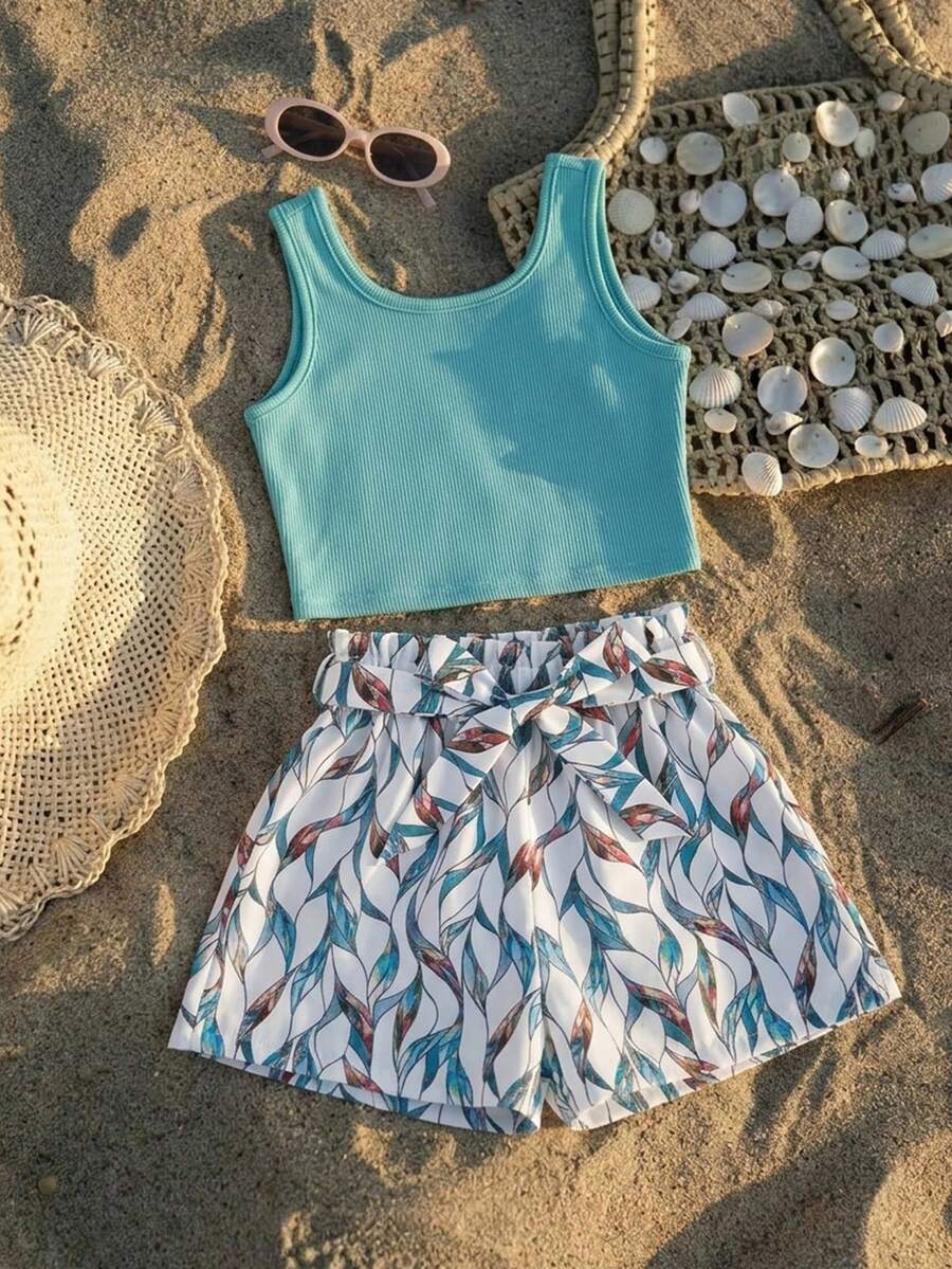 Tween girls 2-piece summer set featuring a turquoise blue ribbed tank top and tropical leaf pattern belted shorts.
