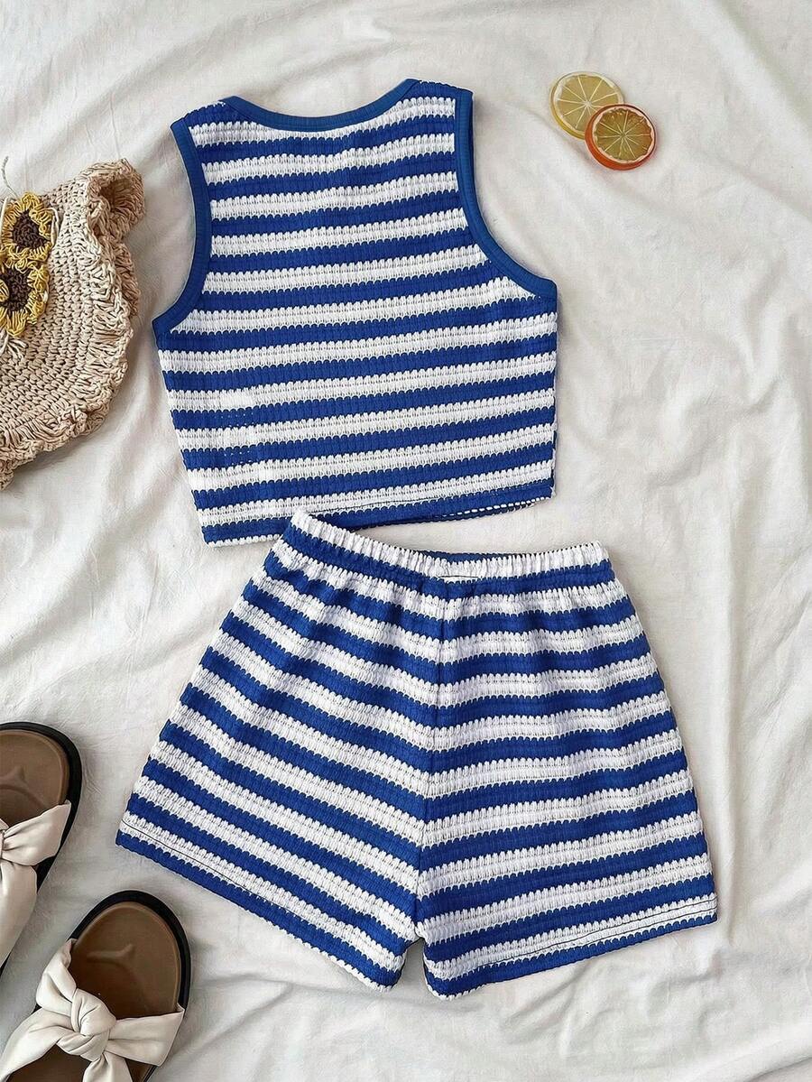 Tween girls black and white two-piece casual summer outfit featuring a rib-knit cropped top with round neck and matching shorts with contrast piping.