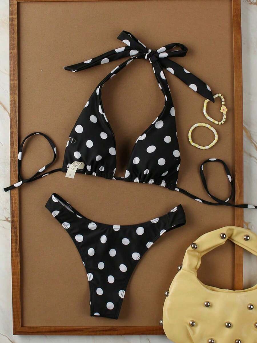 Women's halter neck bikini swimwear set featuring a wireless bra top with removable padding and mid waist bikini bottom.
