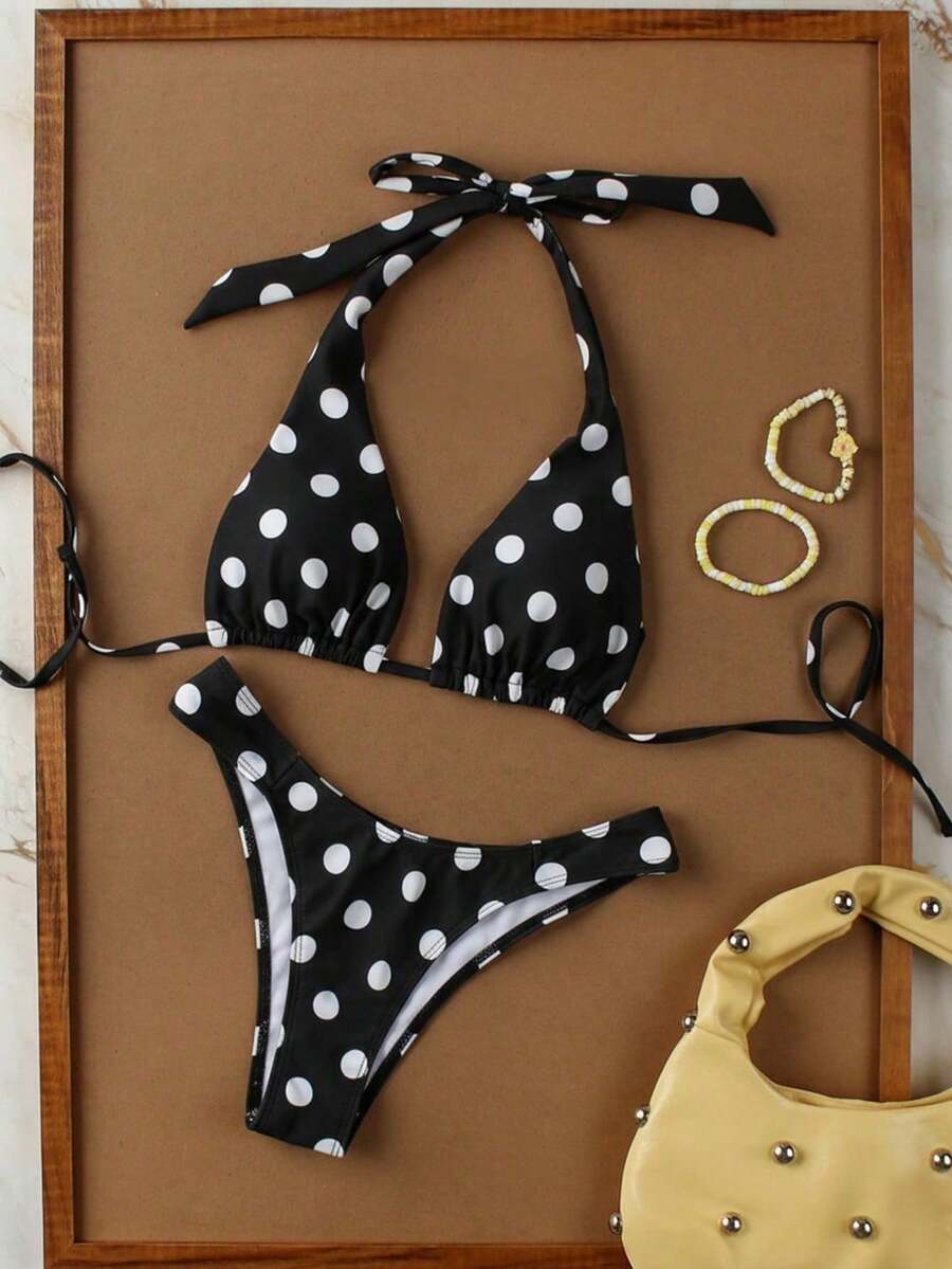 Women's halter neck bikini swimwear set featuring a wireless bra top with removable padding and mid waist bikini bottom.