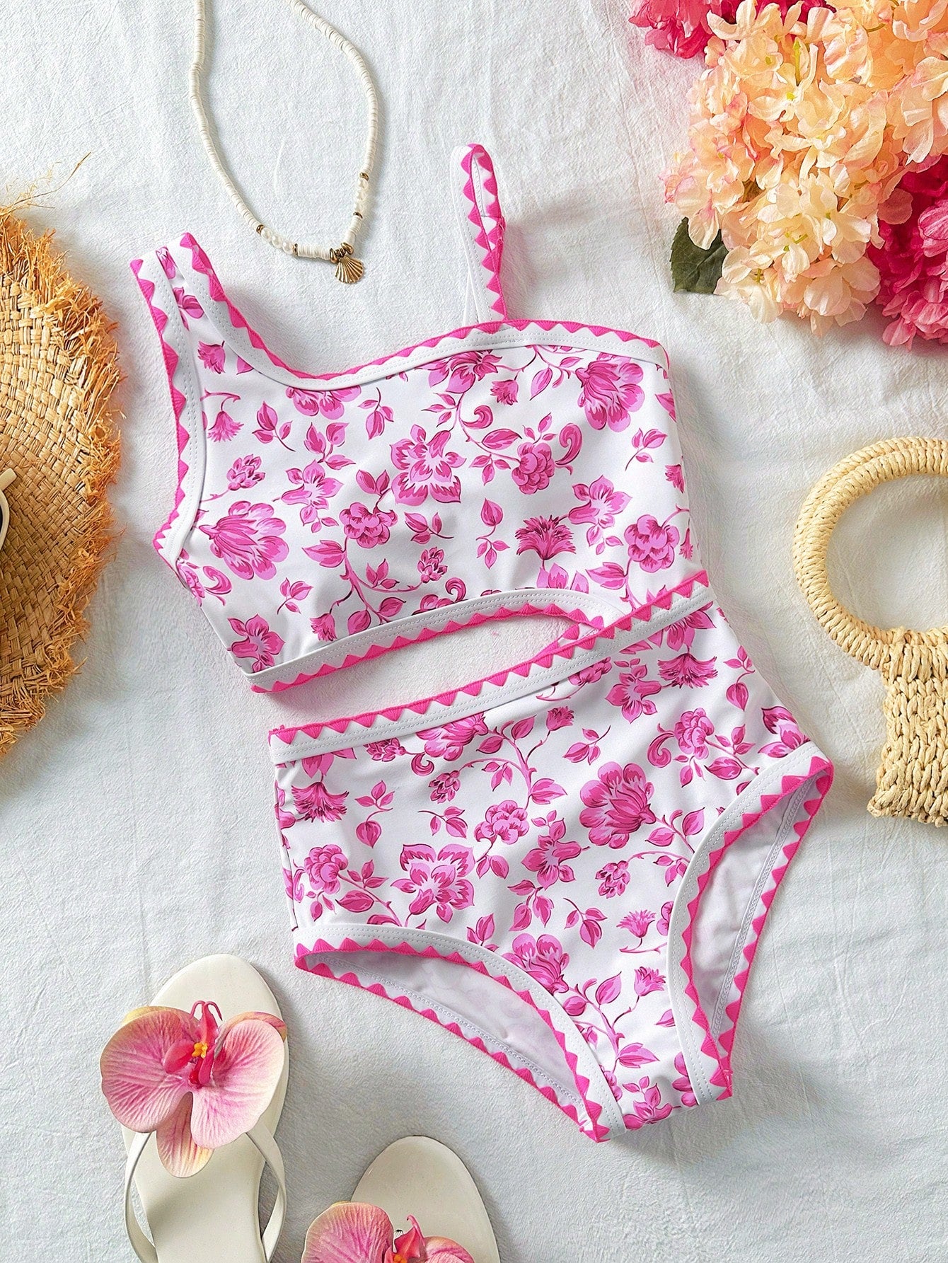 Tween girls one-piece swimsuit featuring an asymmetric neckline, pendant decor, plain design, wireless bra, high-cut bottom, and medium-stretch fabric.