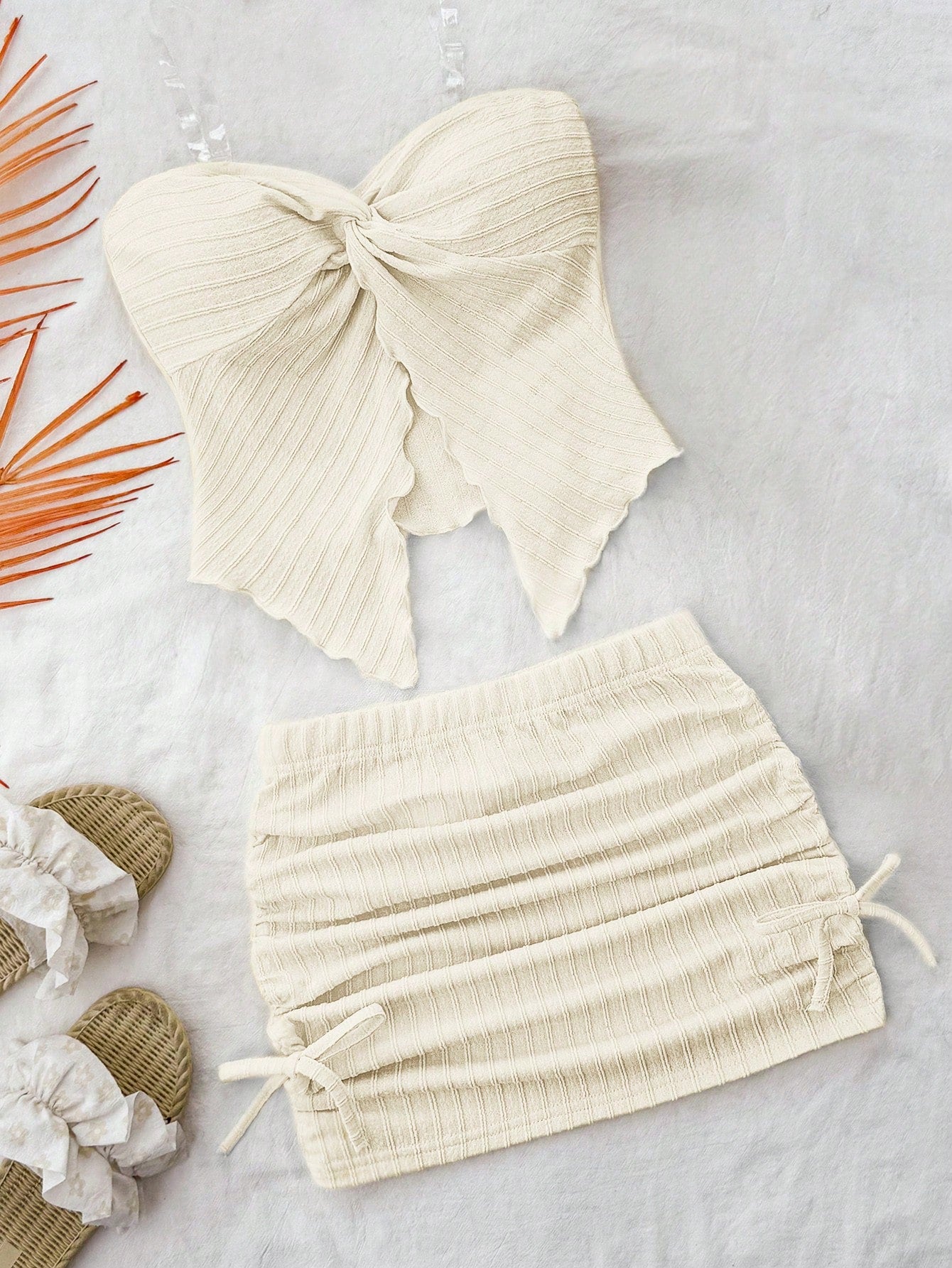 Tween girls apricot two-piece set featuring a spaghetti strap tank top and skirt with ruched lettuce trim.
