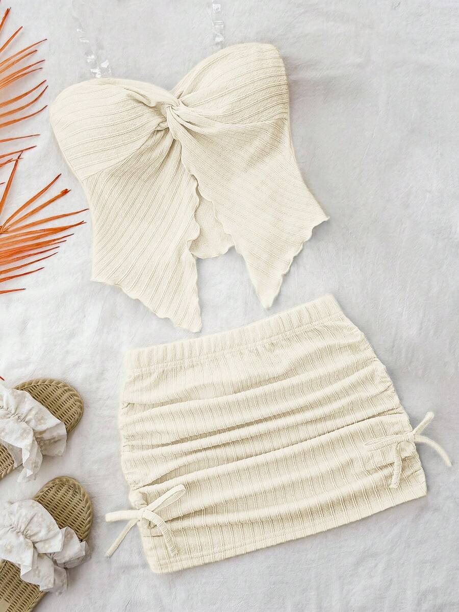 Tween girls apricot two-piece set featuring a spaghetti strap tank top and skirt with ruched lettuce trim.