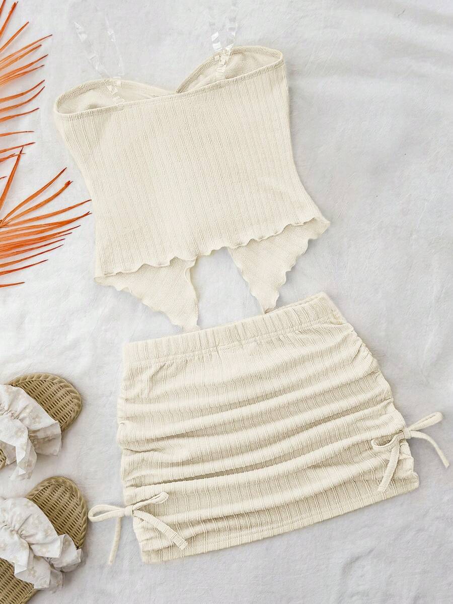 Tween girls apricot two-piece set featuring a spaghetti strap tank top and skirt with ruched lettuce trim.