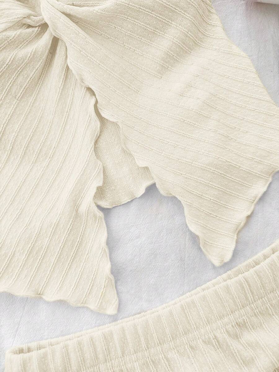 Tween girls apricot two-piece set featuring a spaghetti strap tank top and skirt with ruched lettuce trim.